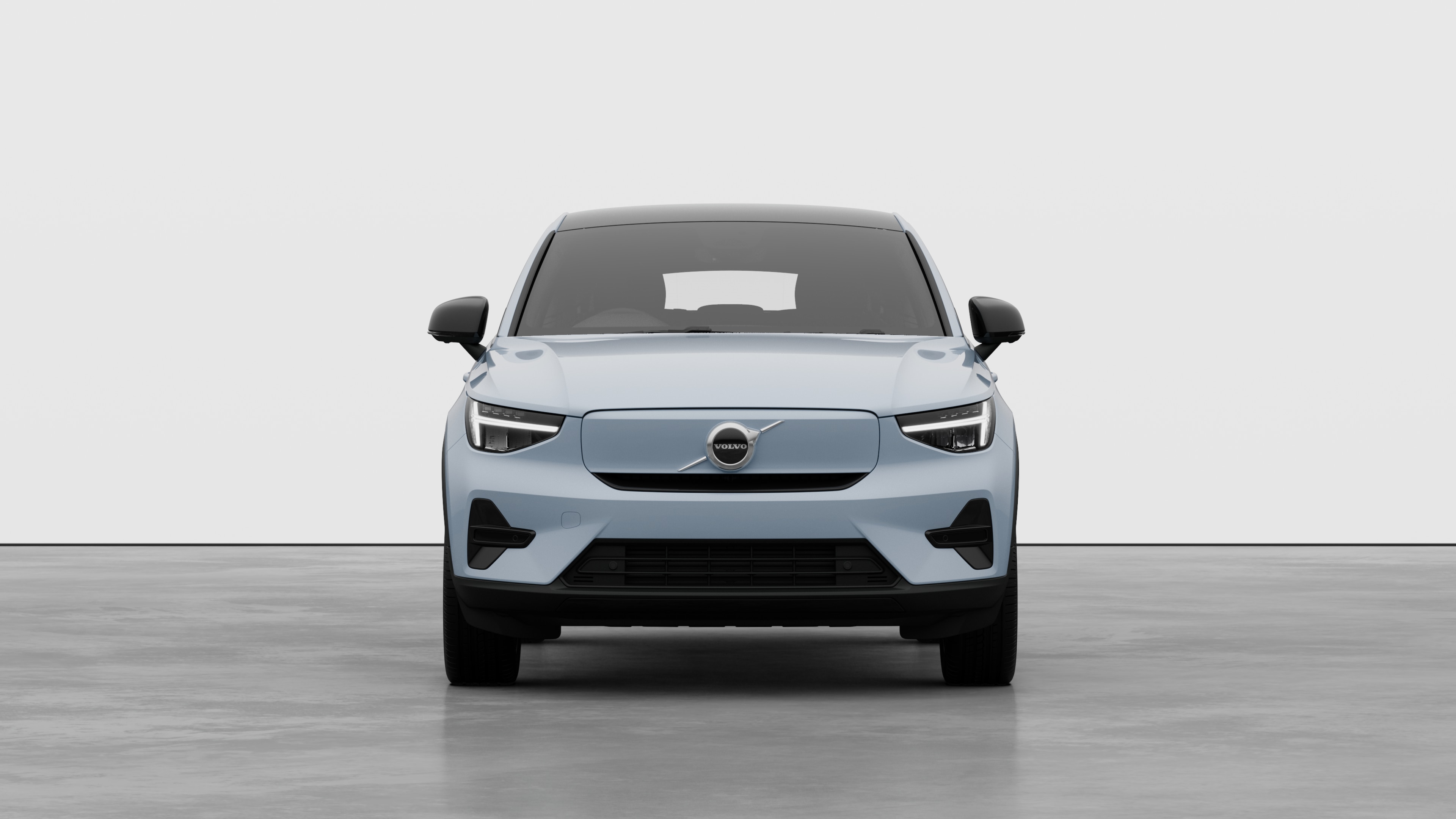 Front view of a Volvo car in a plain studio background.