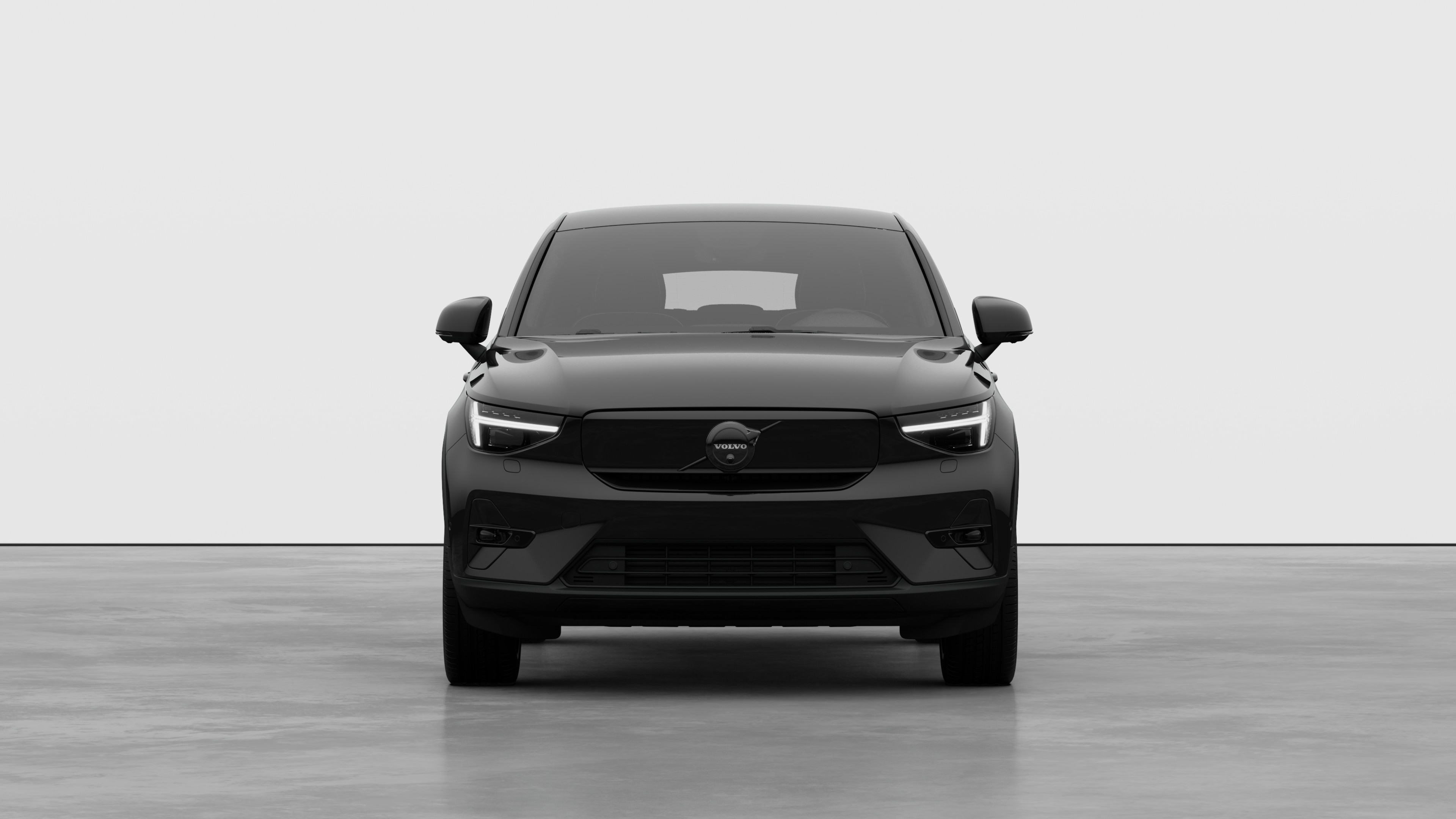 Front view of a Volvo car in a plain studio background.