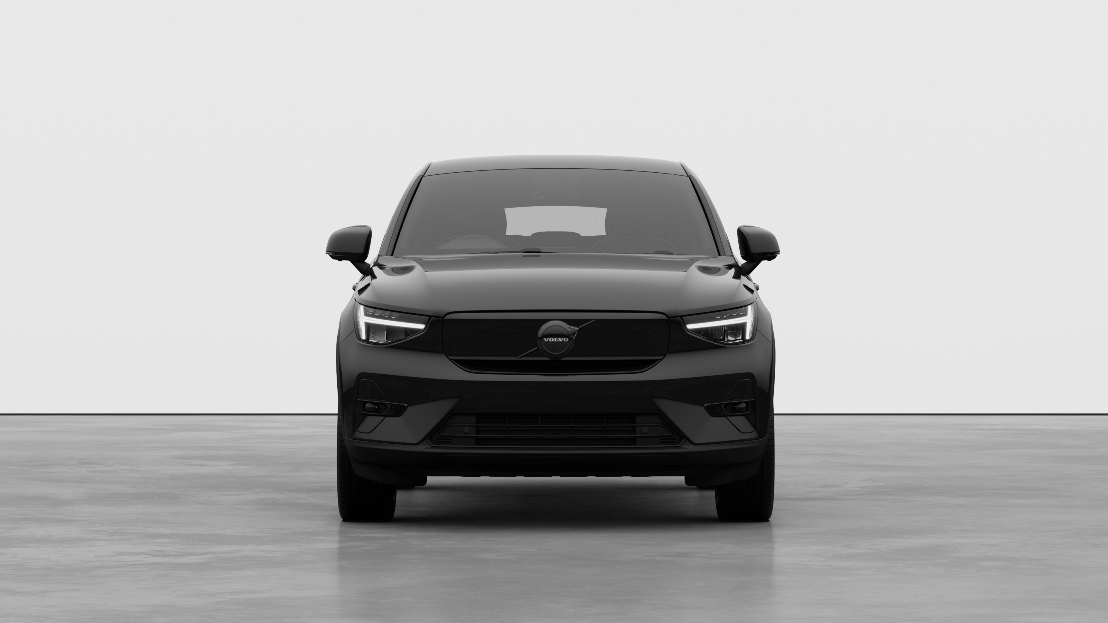 Front view of a Volvo car in a plain studio background.