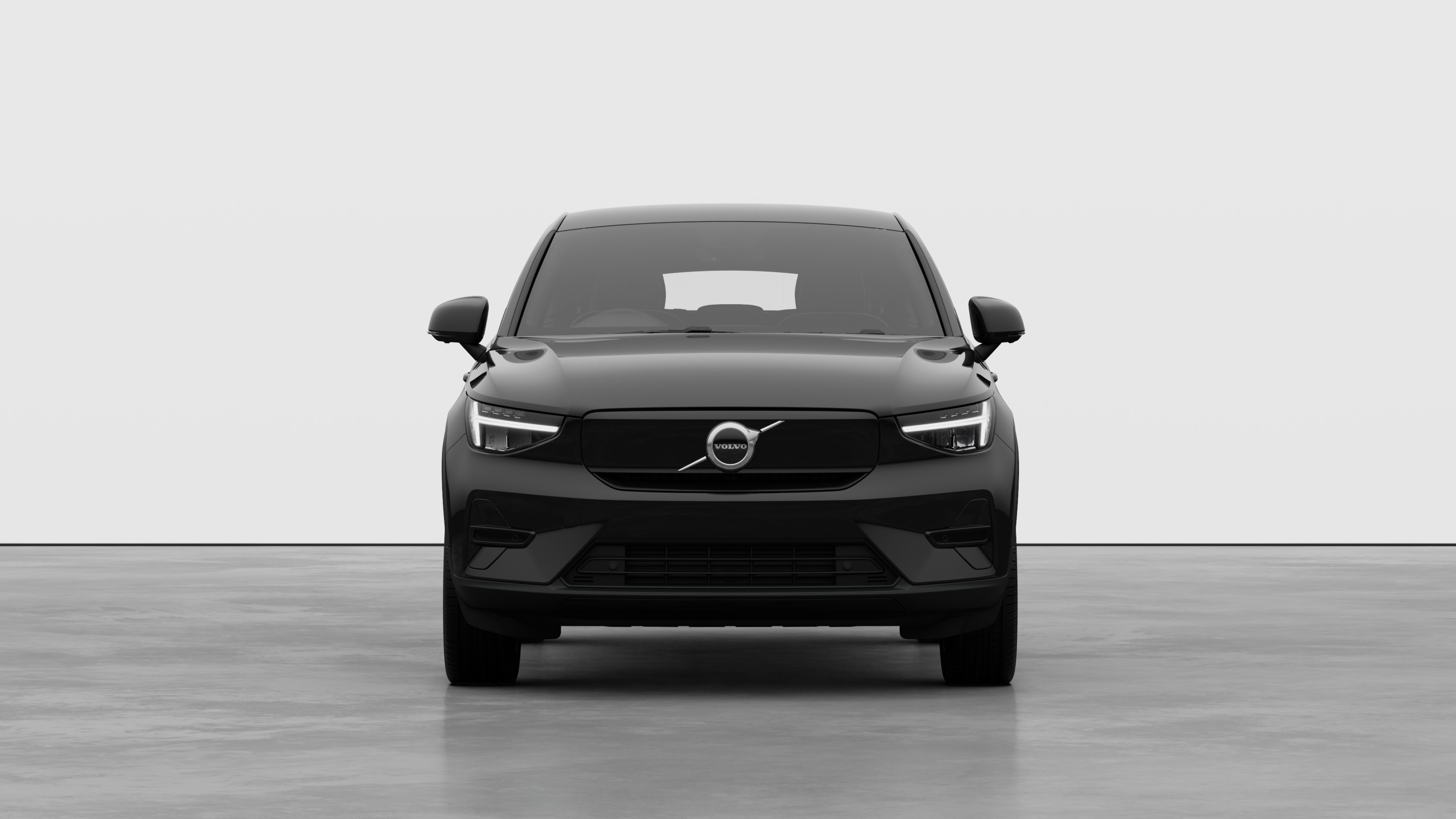 Front view of a Volvo car in a plain studio background.