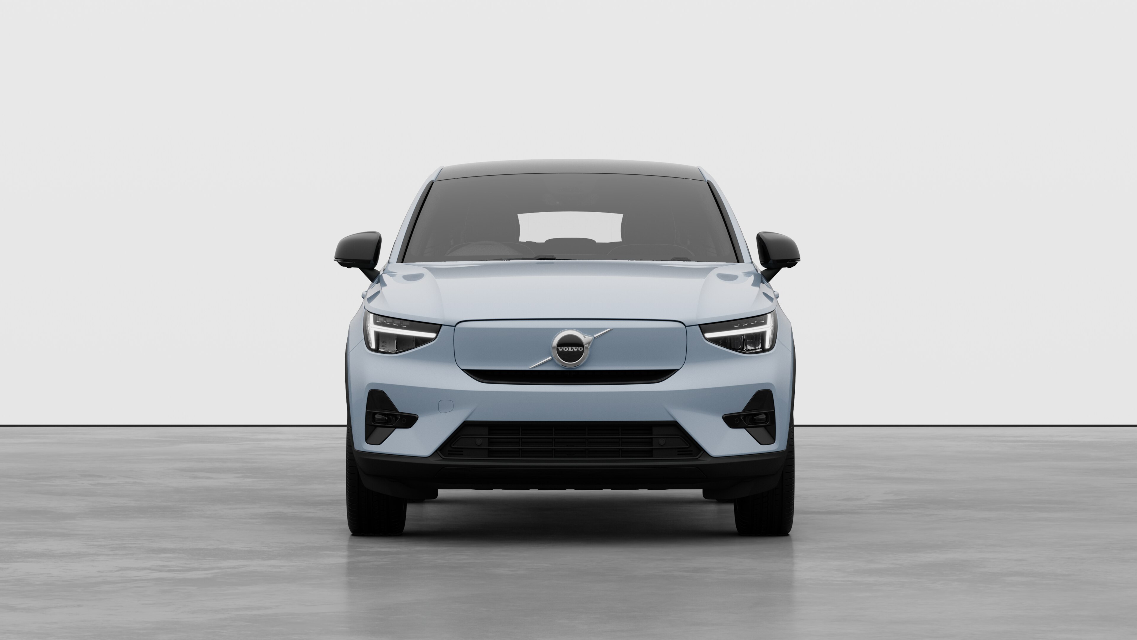 Front view of a Volvo car in a plain studio background.