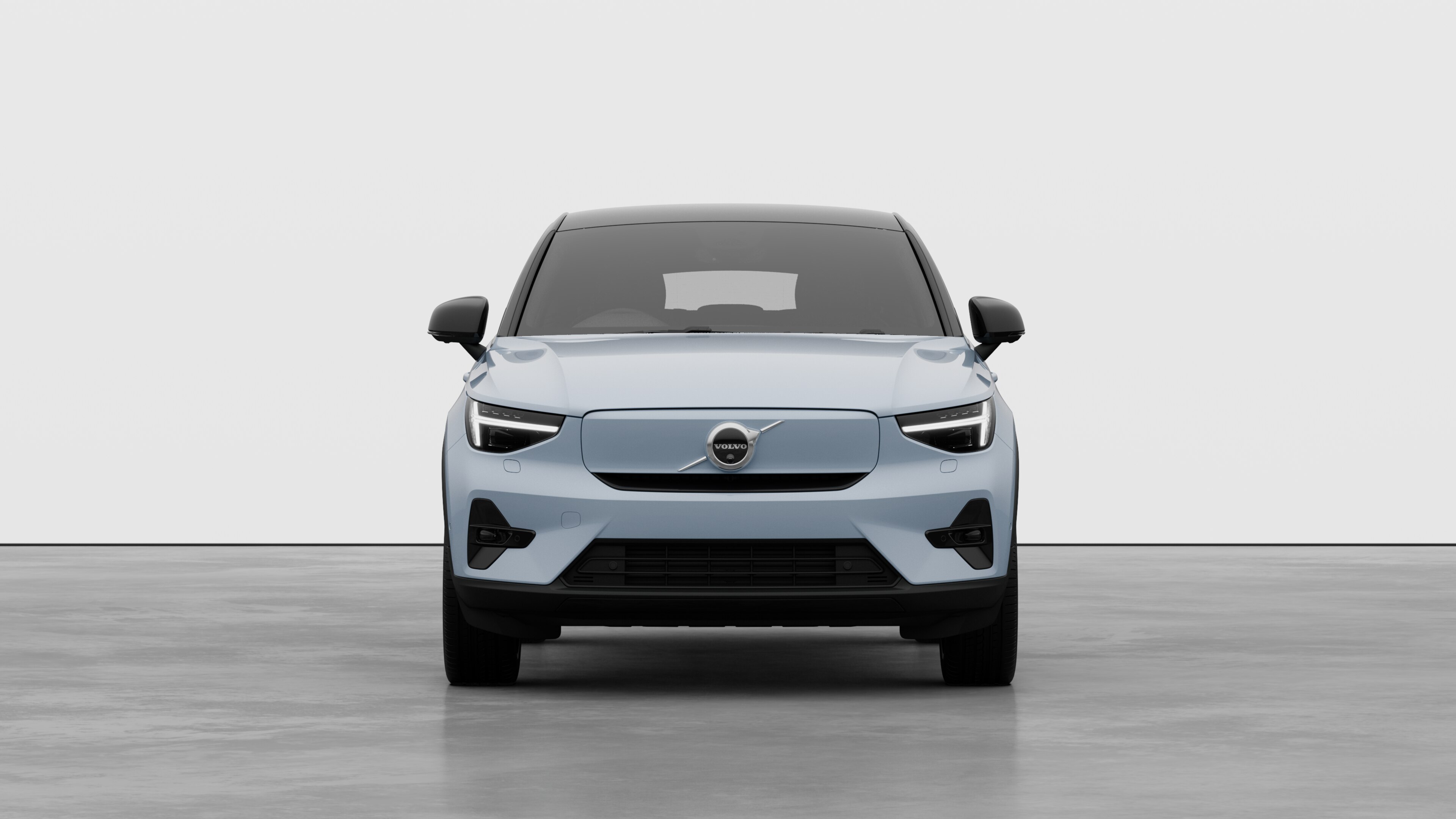 Front view of a Volvo car in a plain studio background.