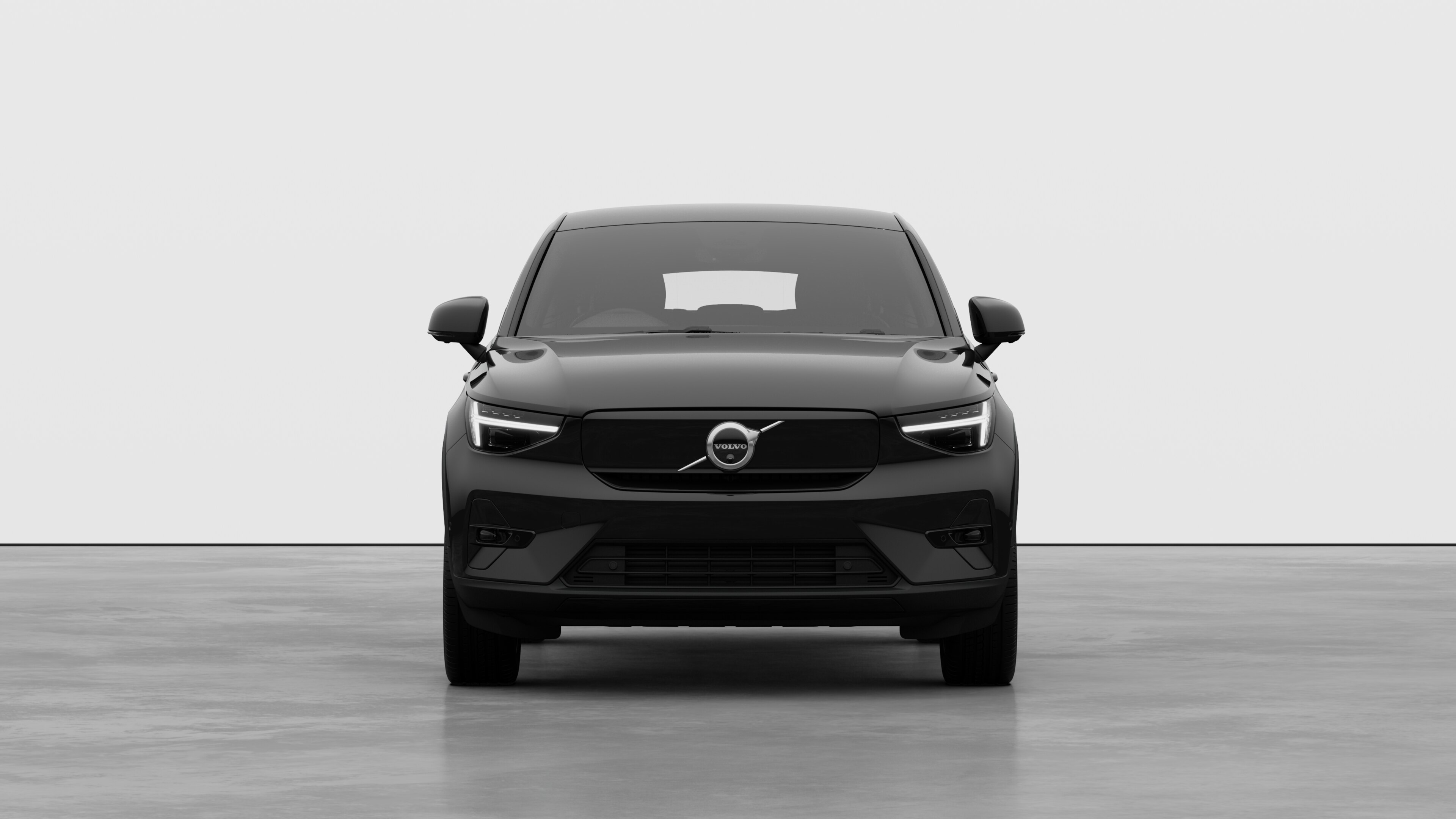 Front view of a Volvo car in a plain studio background.