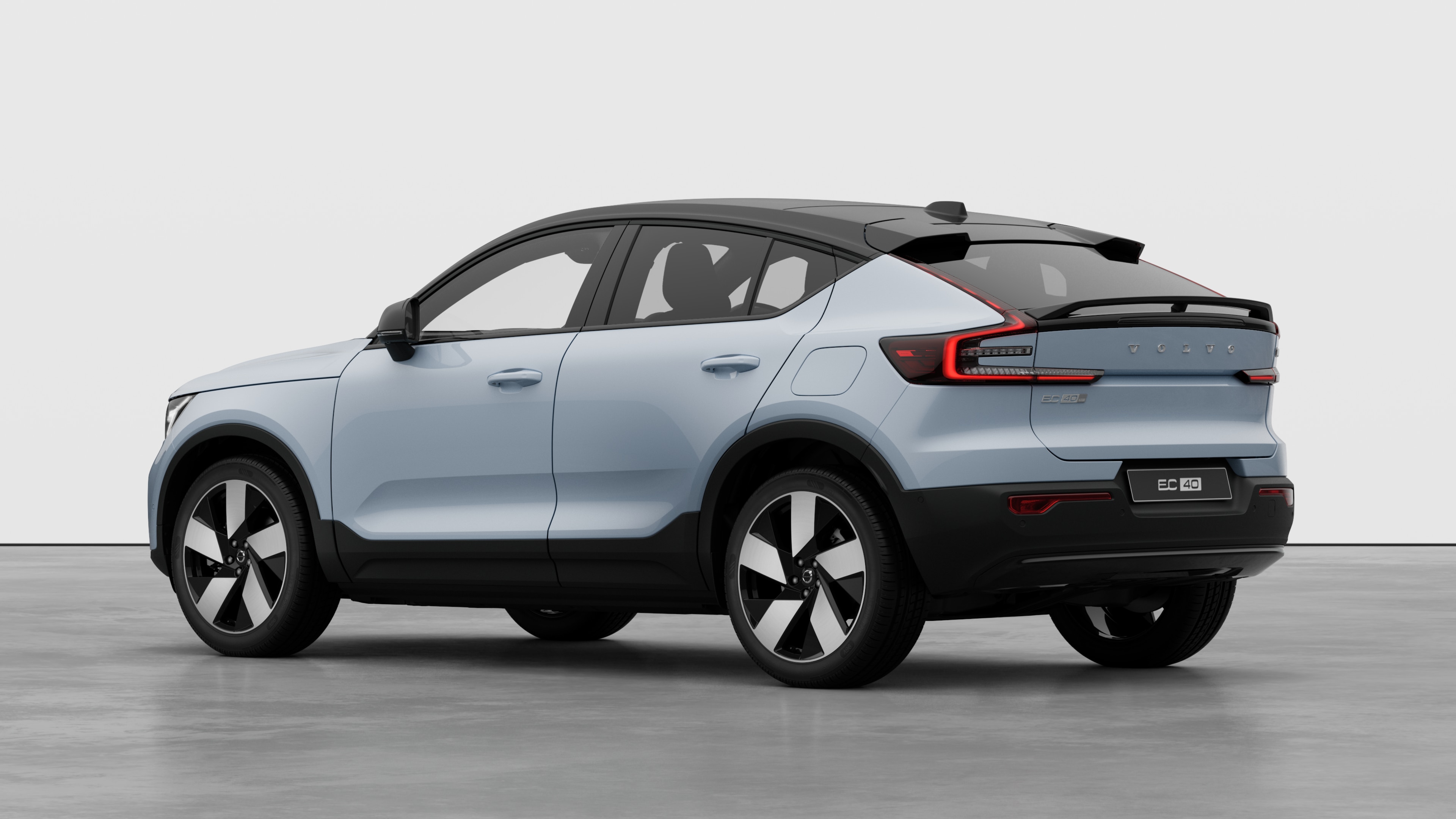 Volvo car rear three-quarter view in a plain studio background.