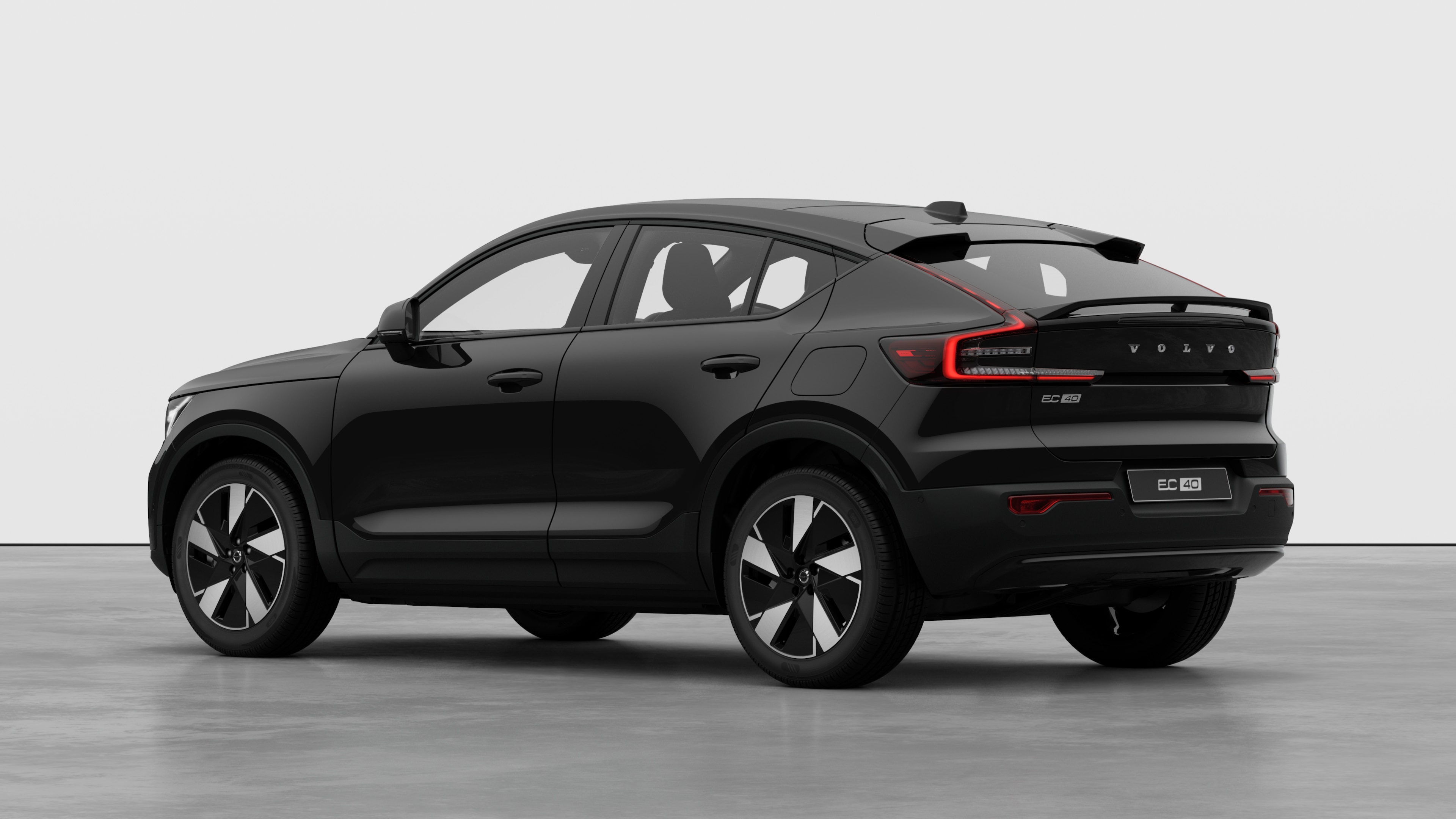 Volvo car rear three-quarter view in a plain studio background.