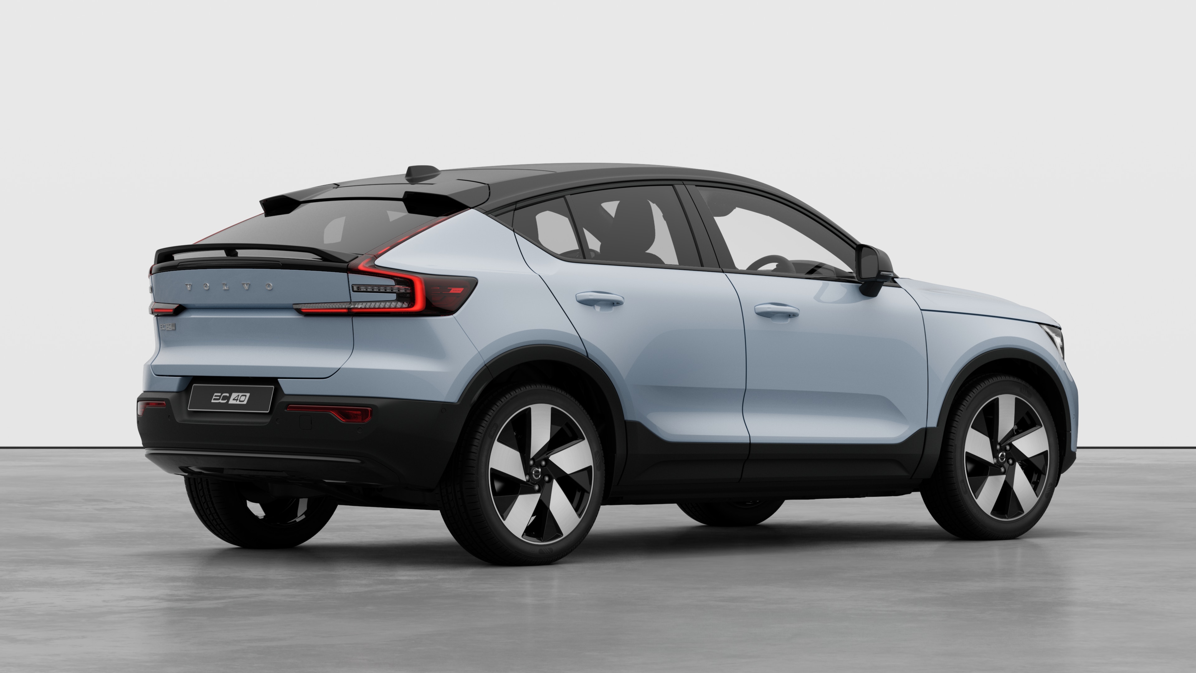 Volvo car rear three-quarter view on plain studio background.