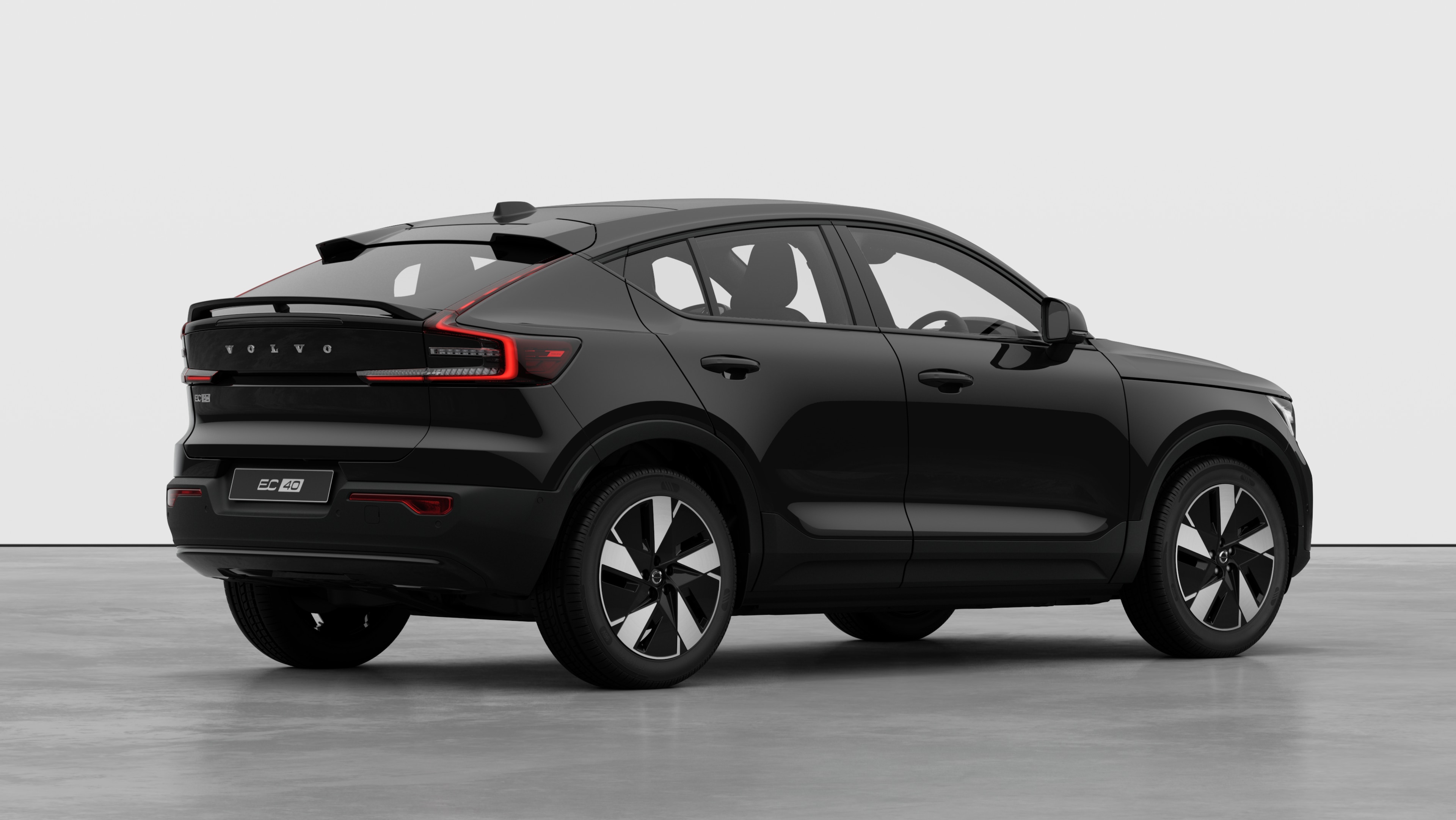 Volvo car rear three-quarter view on plain studio background.