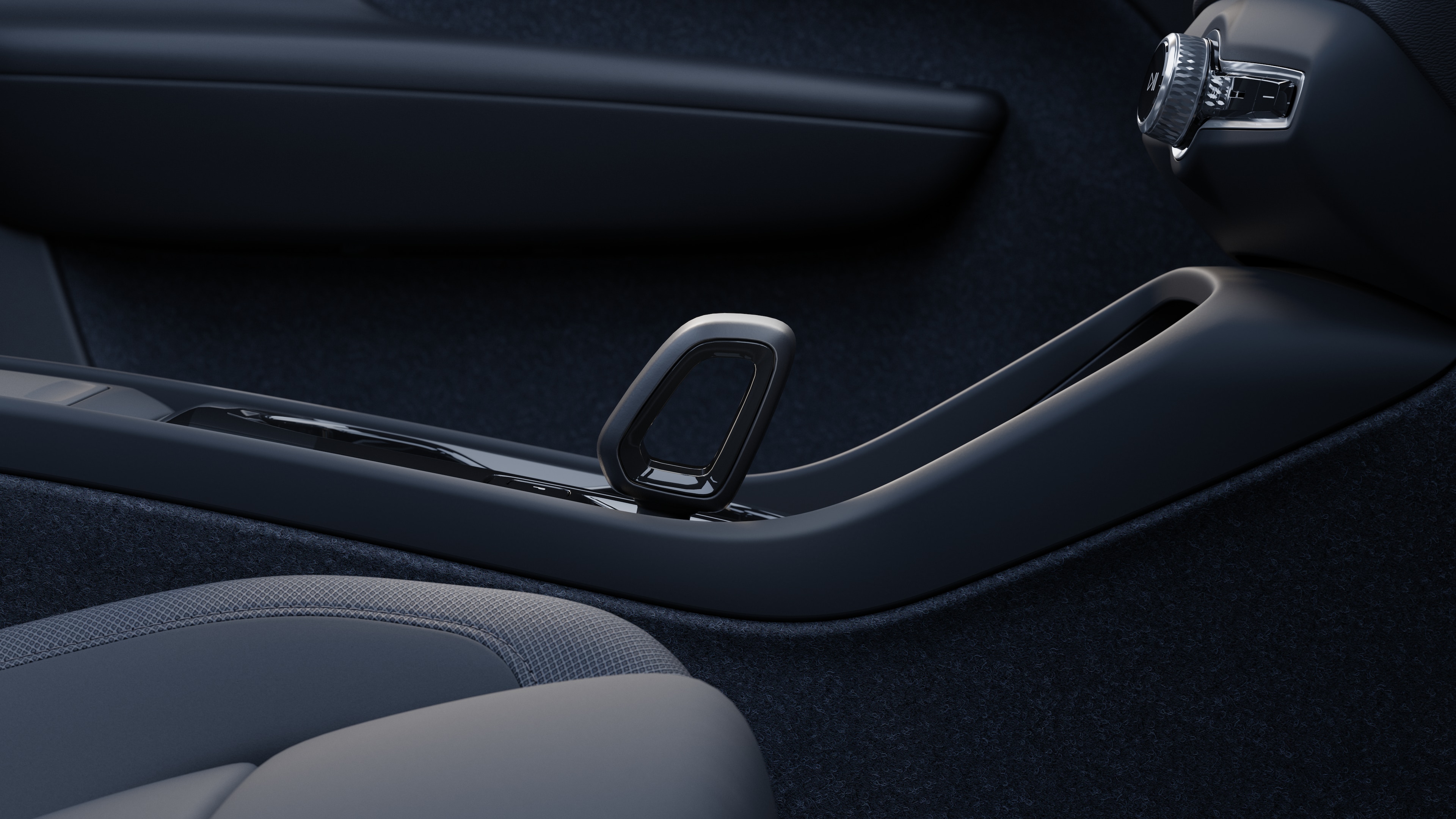 Volvo car interior showing dashboard, steering wheel, and center console with digital display in an open road background.