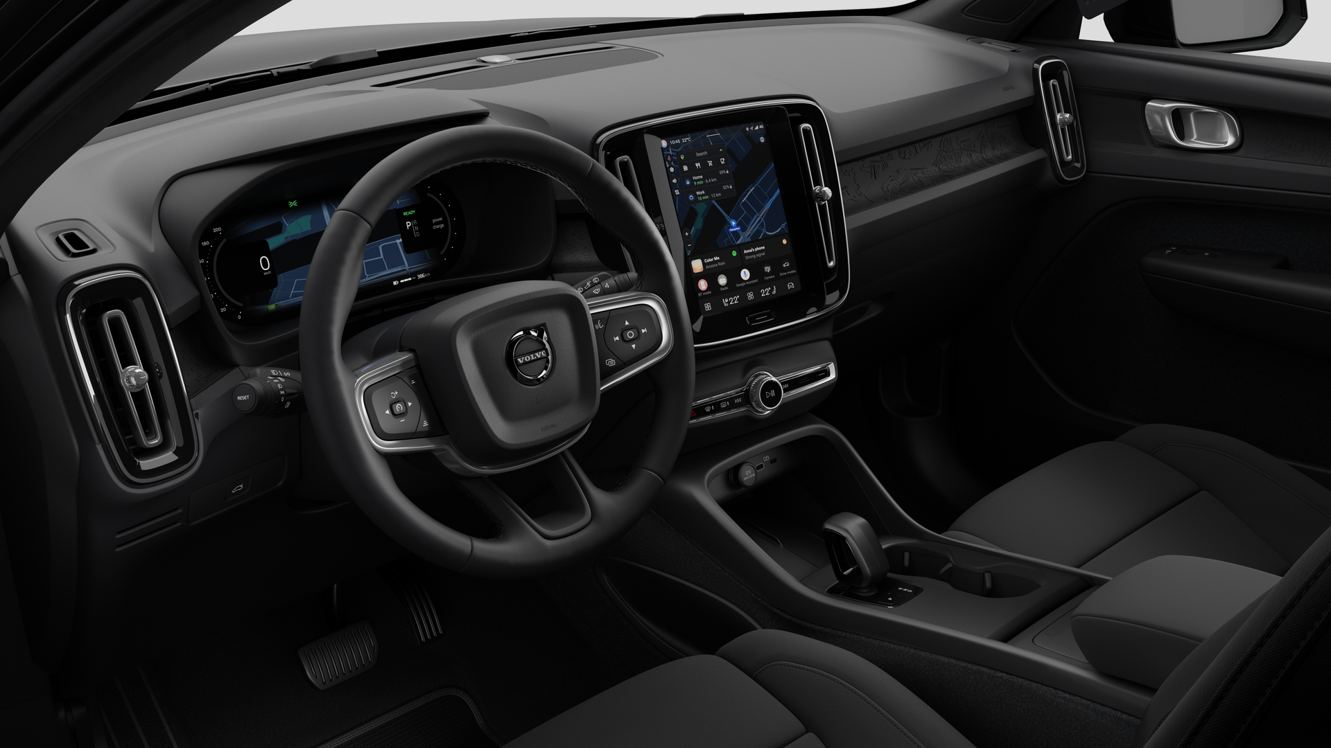 Sisäkuva Volvo -autosta, jossa näkyy kojelauta, ohjauspyörä, keskikonsoli ja digitaalinen näyttö tavallisella studiotaustalla.