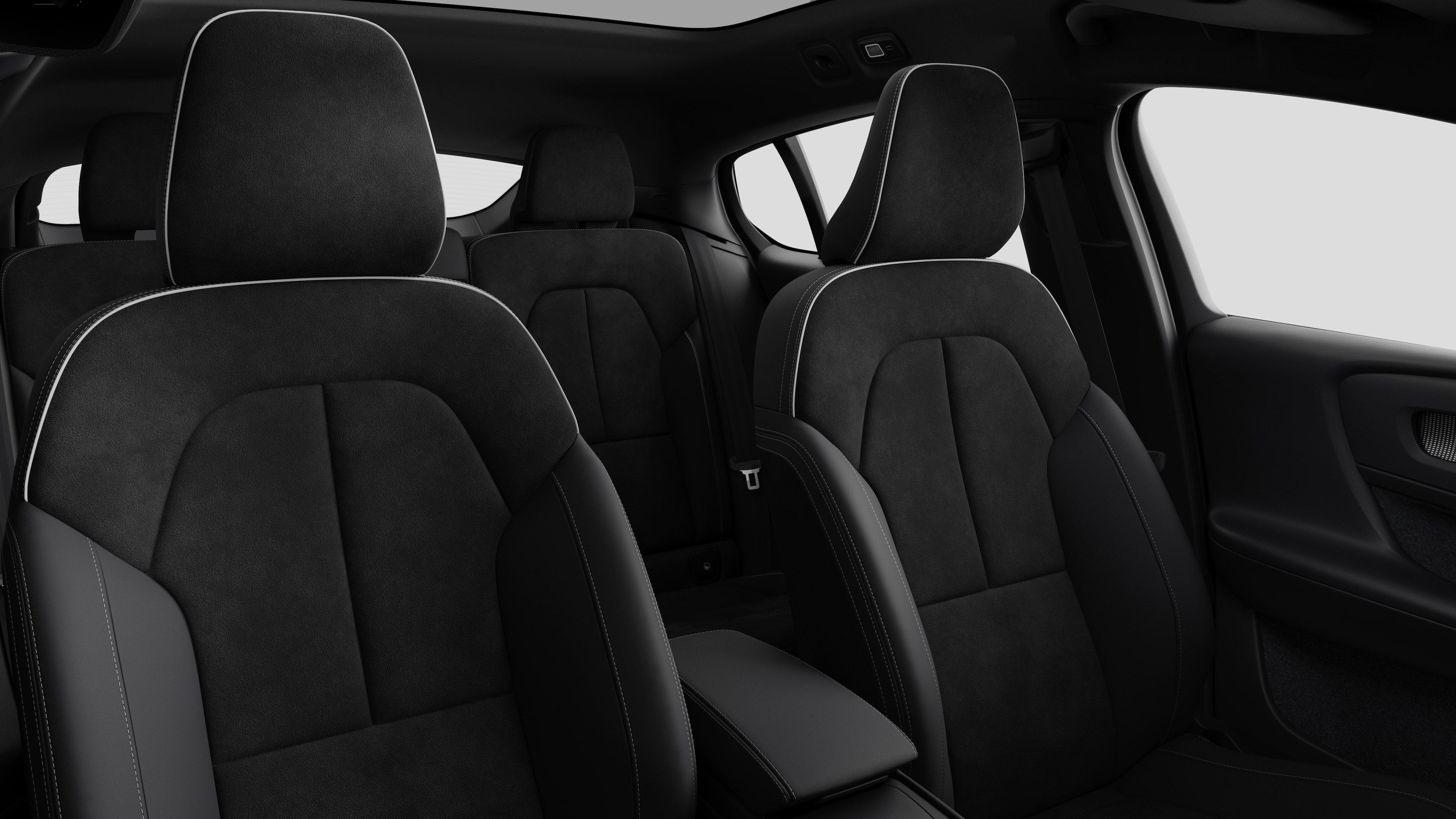Volvo car interior showing rear passenger seats and center console in plain studio background.
