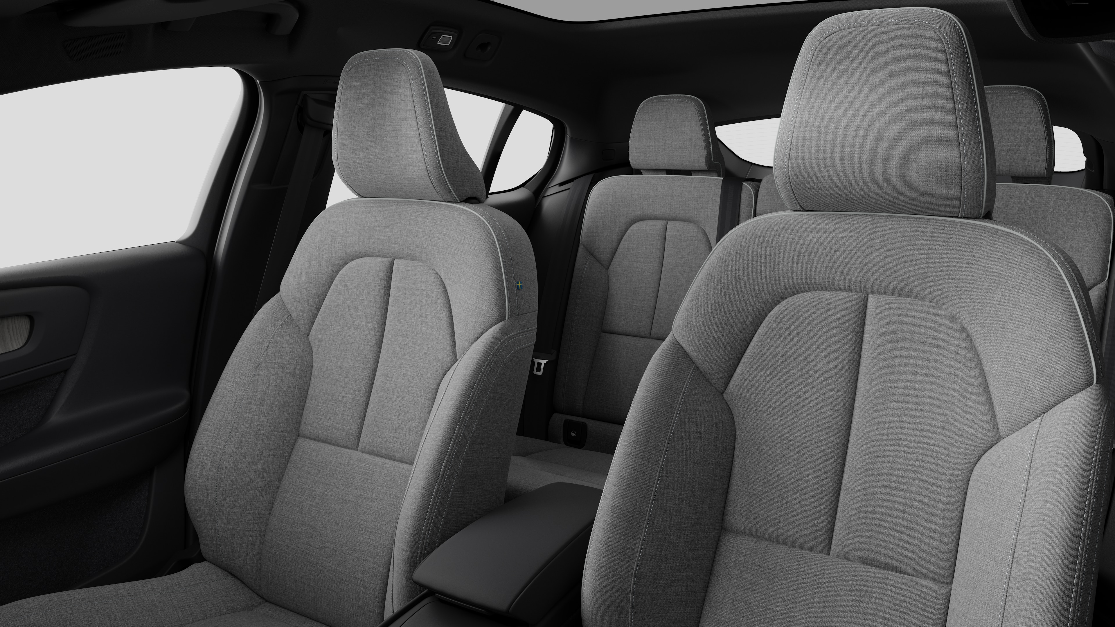 Interior do carro Volvo mostrando os bancos traseiros do passageiro e o console central em fundo de estúdio simples.