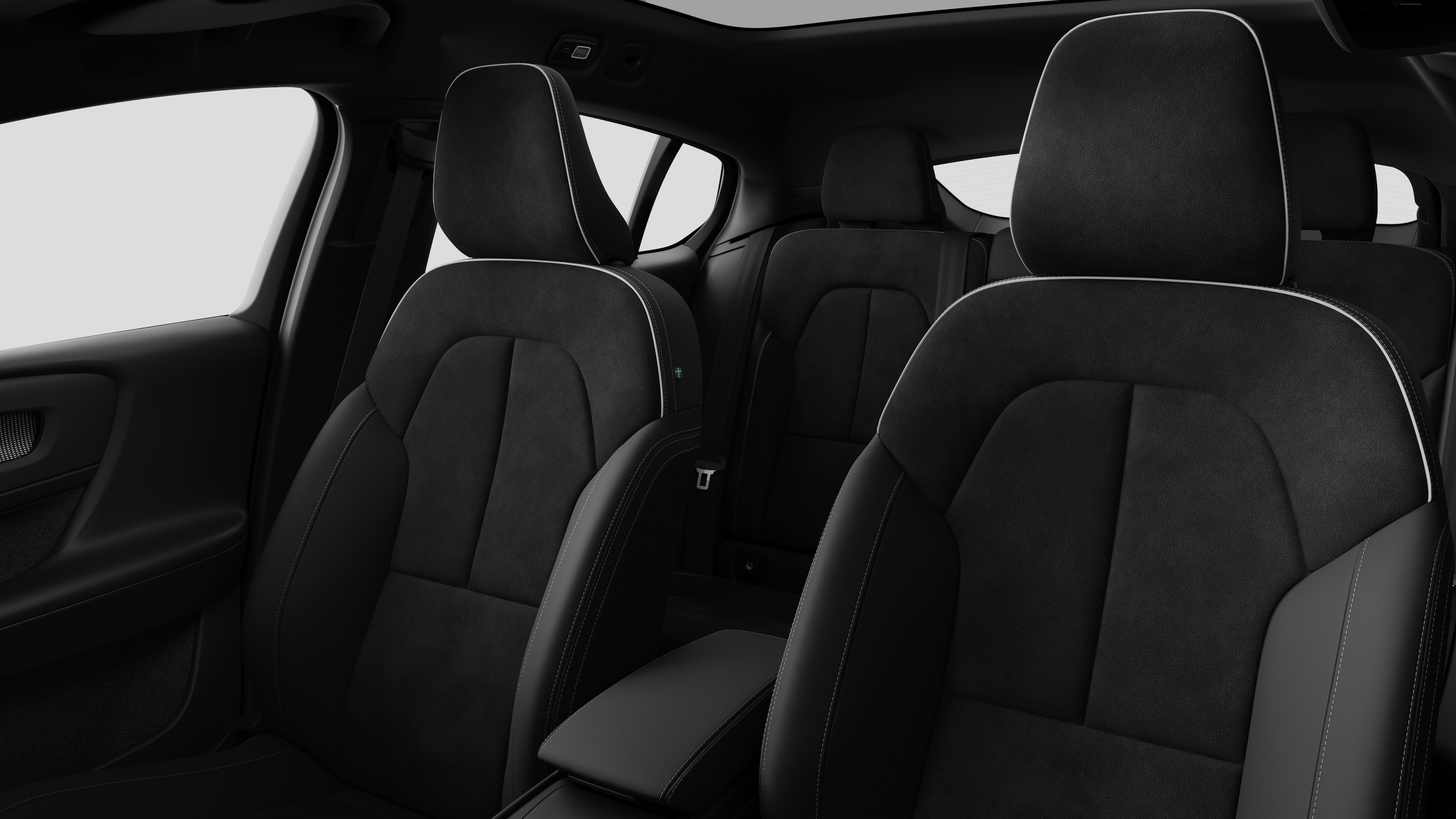 Volvo car interior showing rear passenger seats and center console in plain studio background.