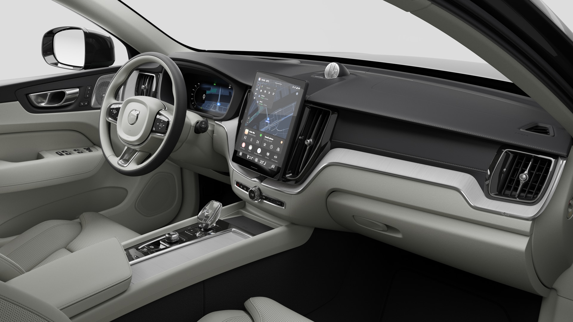 Vue intérieure d’une Volvo montrant le tableau de bord, le volant, la console centrale et l’écran d’affichage numérique sur un fond de studio uni.