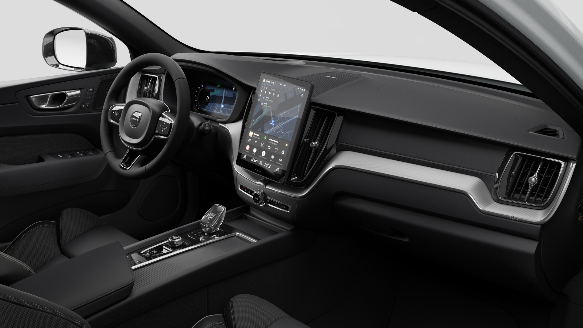Vue intérieure d’une Volvo montrant le tableau de bord, le volant, la console centrale et l’écran d’affichage numérique sur un fond de studio uni.
