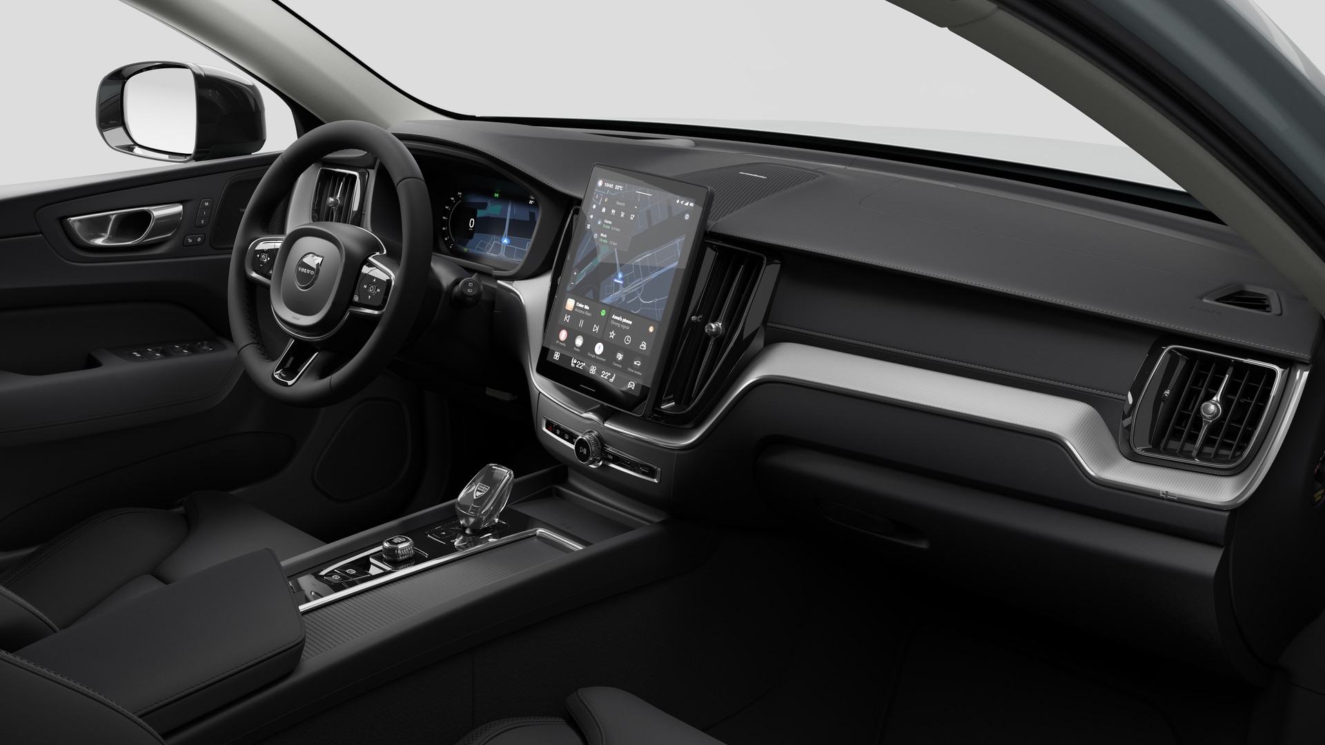 Vue intérieure d’une Volvo montrant le tableau de bord, le volant, la console centrale et l’écran d’affichage numérique sur un fond de studio uni.