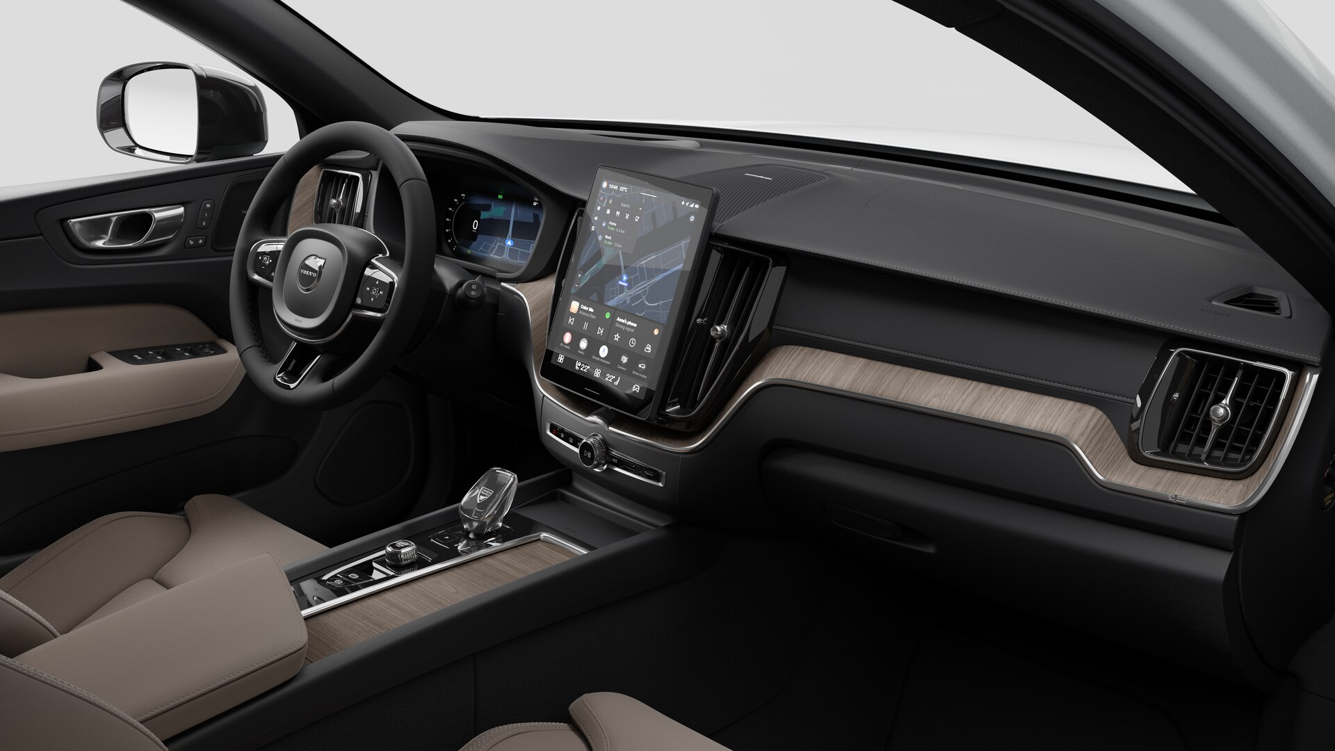 Vue intérieure d’une Volvo montrant le tableau de bord, le volant, la console centrale et l’écran d’affichage numérique sur un fond de studio uni.