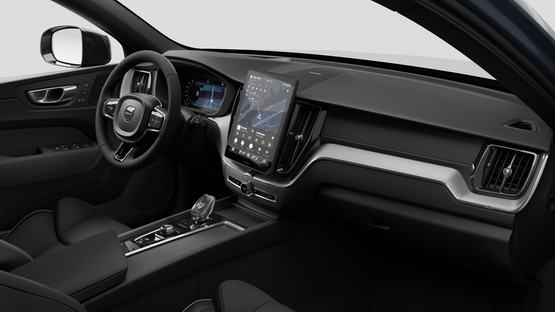 Vue intérieure d’une Volvo montrant le tableau de bord, le volant, la console centrale et l’écran d’affichage numérique sur un fond de studio uni.