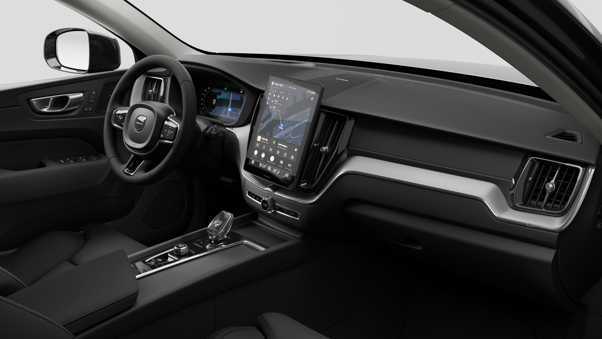 Vue intérieure d’une Volvo montrant le tableau de bord, le volant, la console centrale et l’écran d’affichage numérique sur un fond de studio uni.