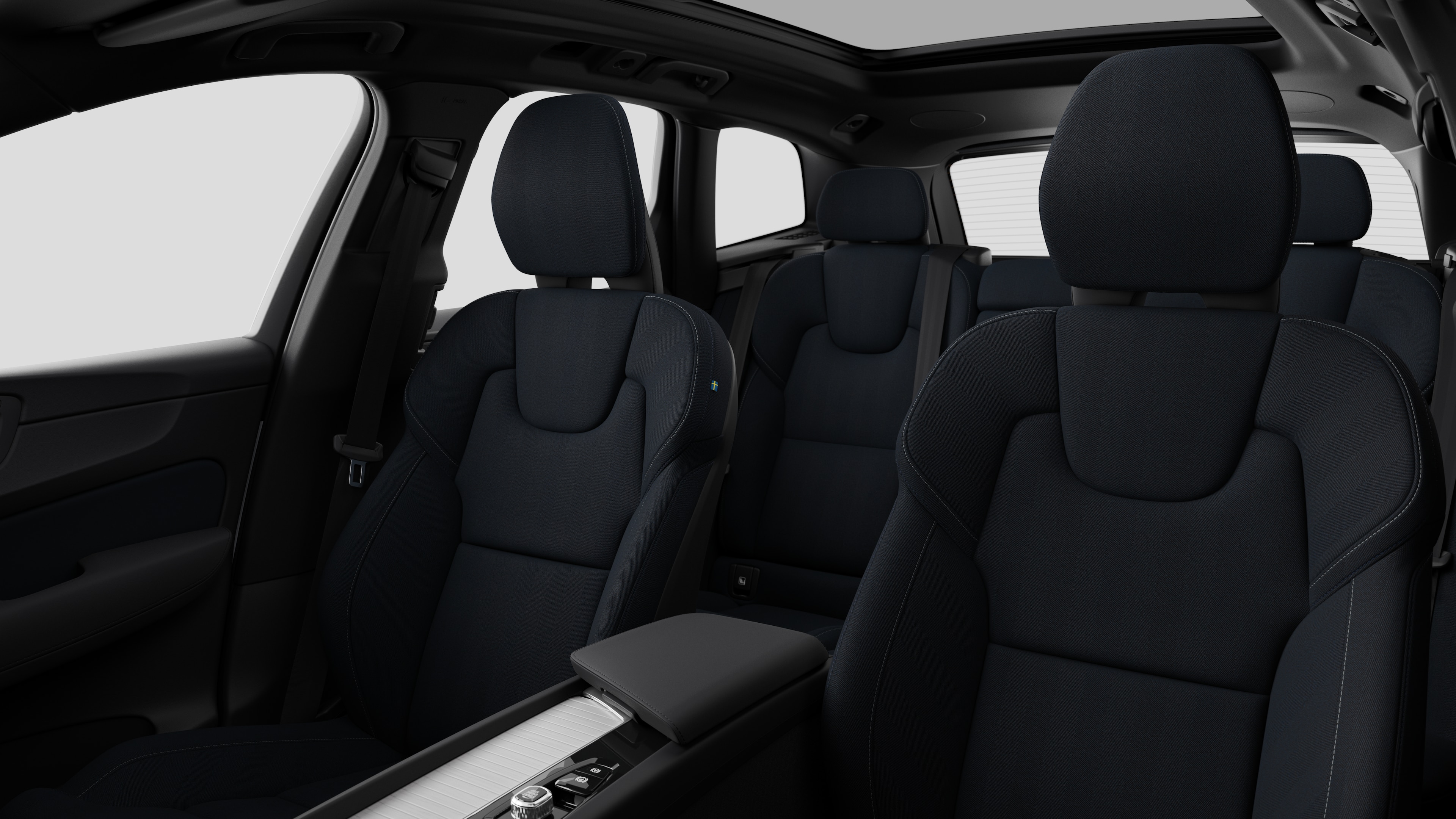 Volvo car interior showing rear passenger seats and center console in plain studio background.