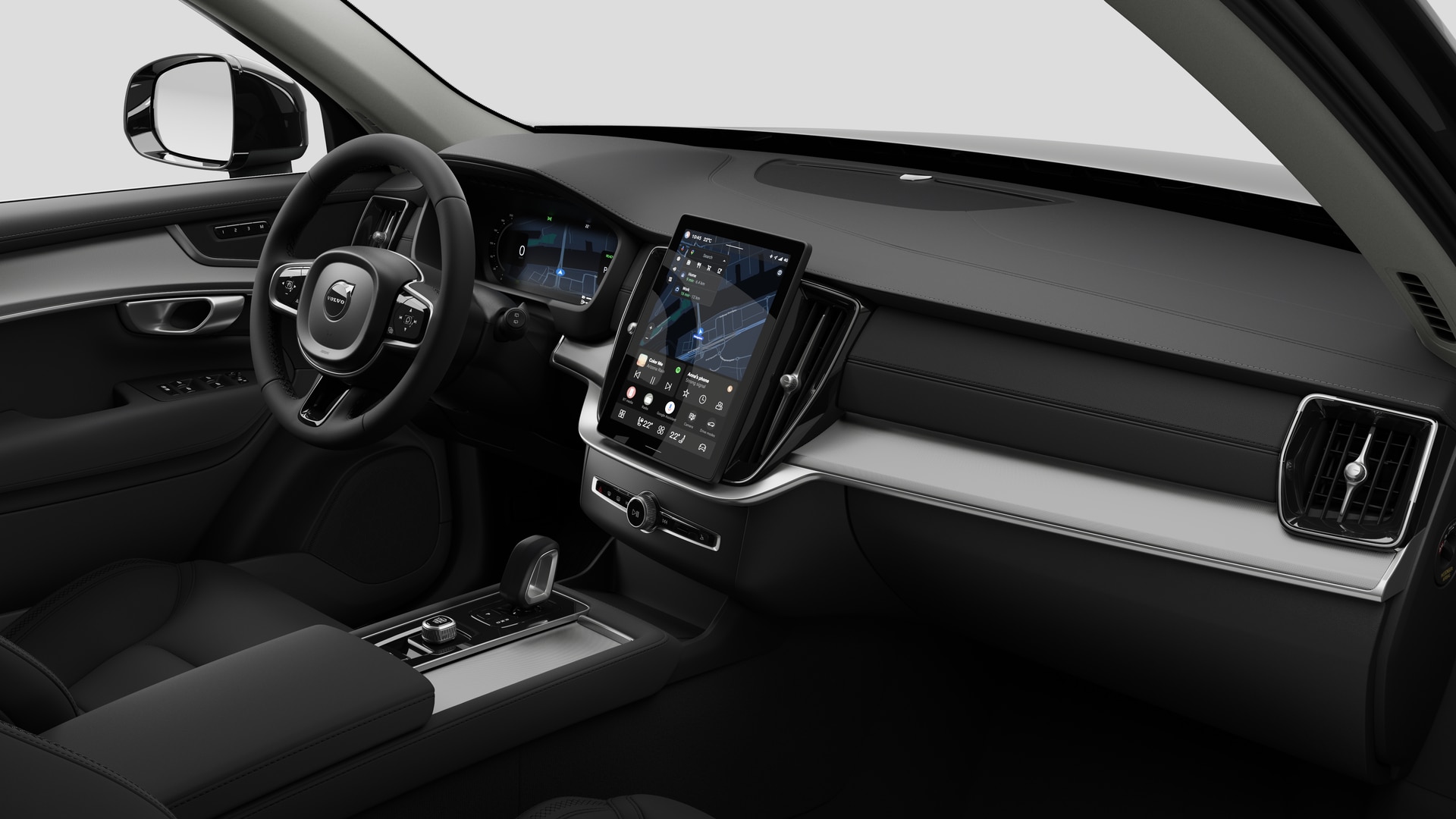 Vista interna di un'auto Volvo che mostra il cruscotto, il volante, la console centrale e lo schermo digitale sullo sfondo di uno studio.