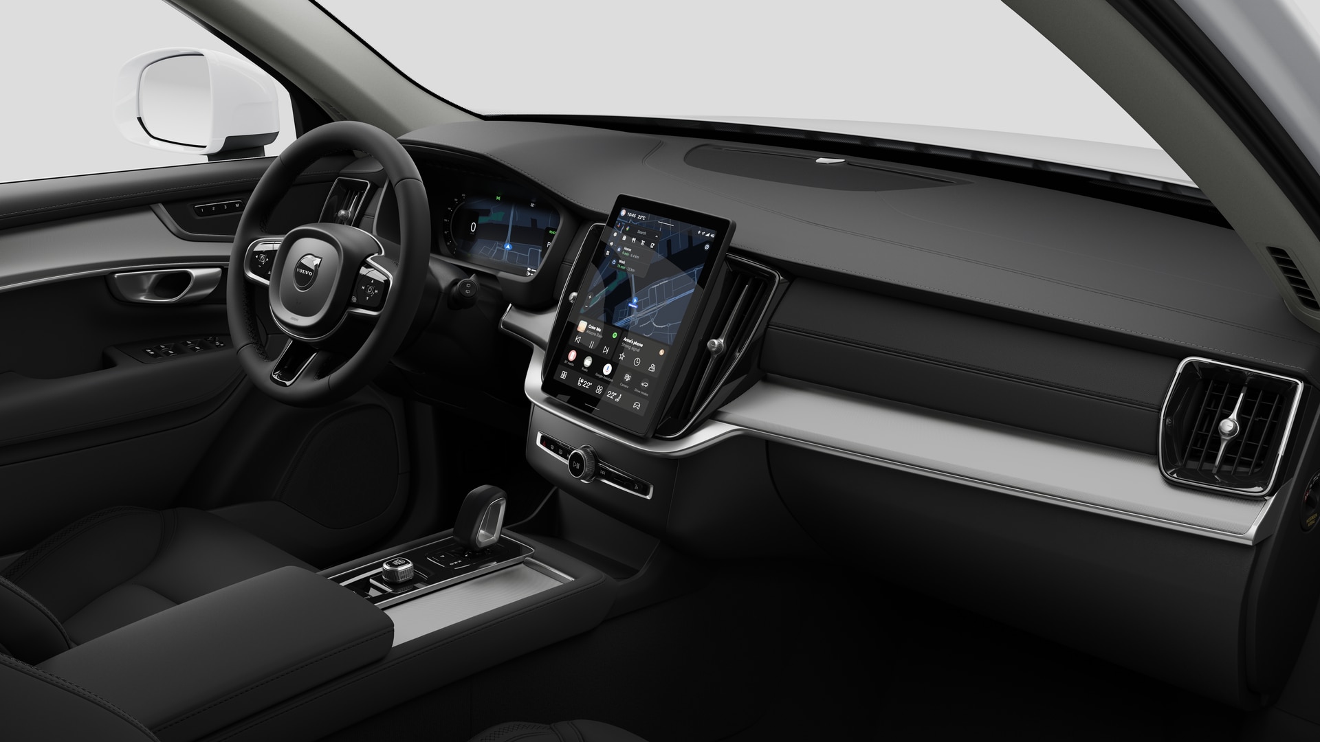 Sisäkuva Volvo -autosta, jossa näkyy kojelauta, ohjauspyörä, keskikonsoli ja digitaalinen näyttö tavallisella studiotaustalla.