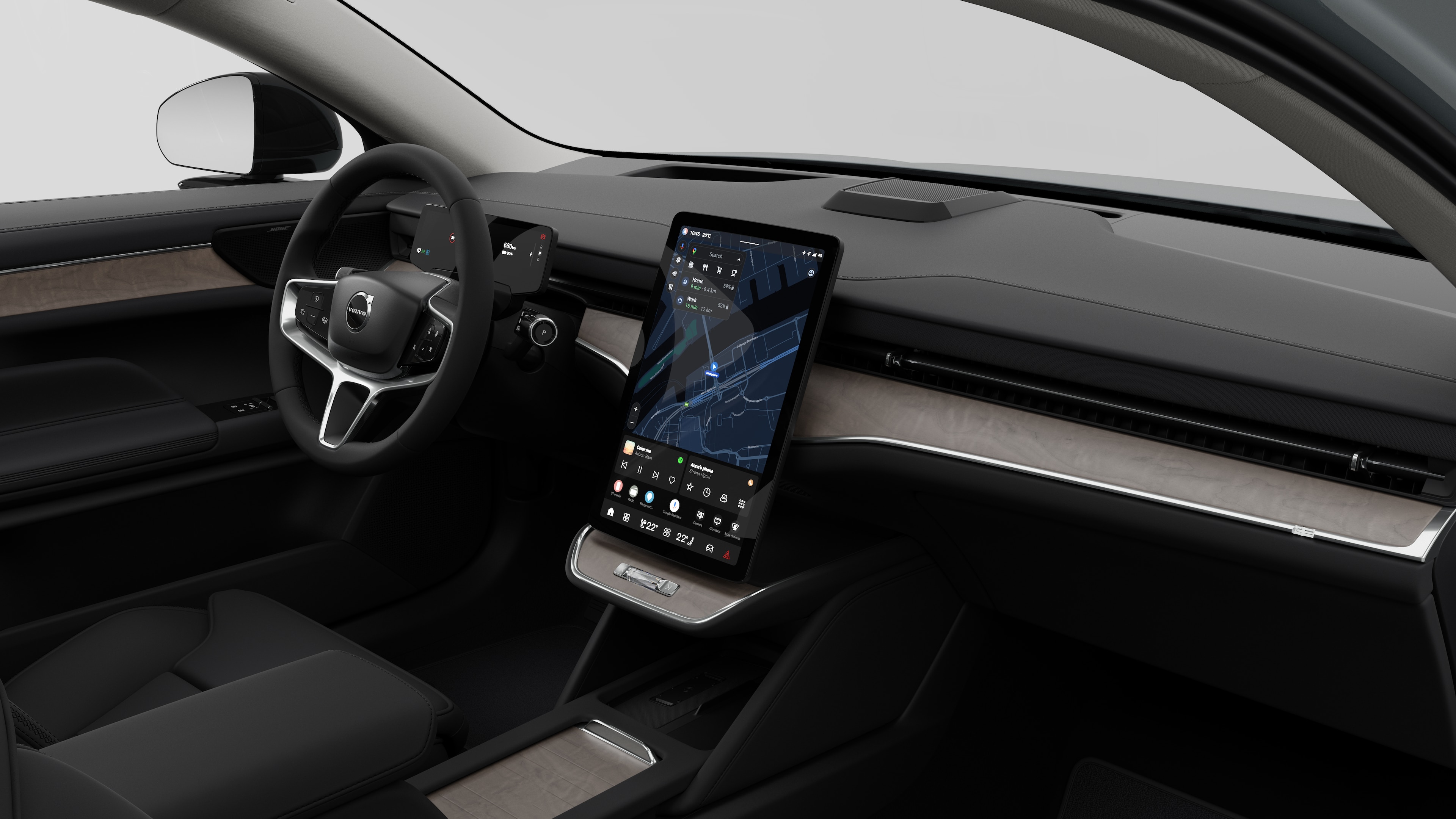 Interiörvy av en Volvobil som visar instrumentbrädan, ratten, mittkonsolen och den digitala skärmen i en vanlig studiobakgrund.