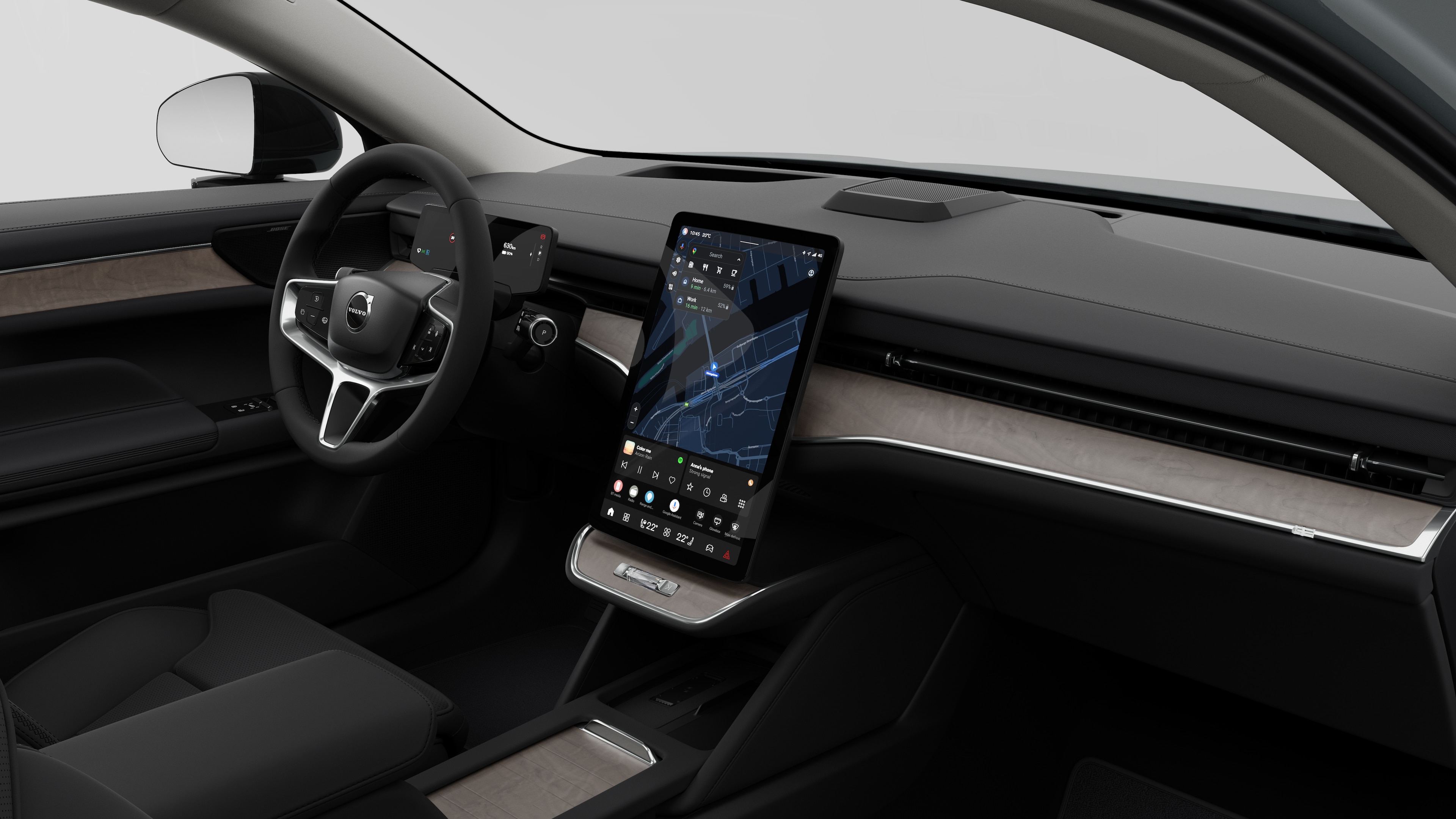 Indvendigt billede af en Volvo-bil, der viser instrumentbrættet, rattet, midterkonsollen og den digitale skærm i en almindelig studiebaggrund.