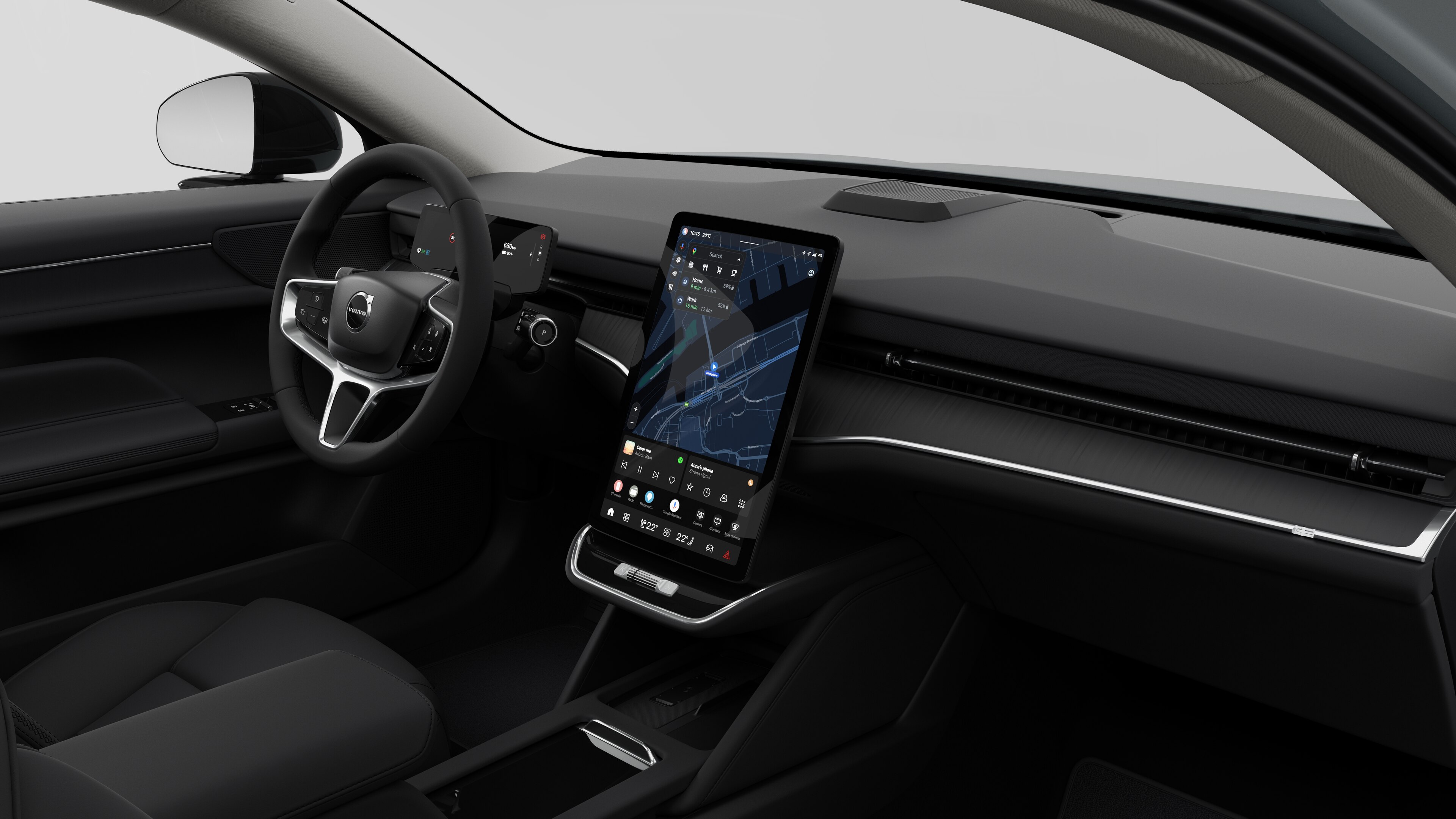 Binnenaanzicht van een Volvo met het dashboard, stuur, middenconsole en digitale display op een effen studioachtergrond.