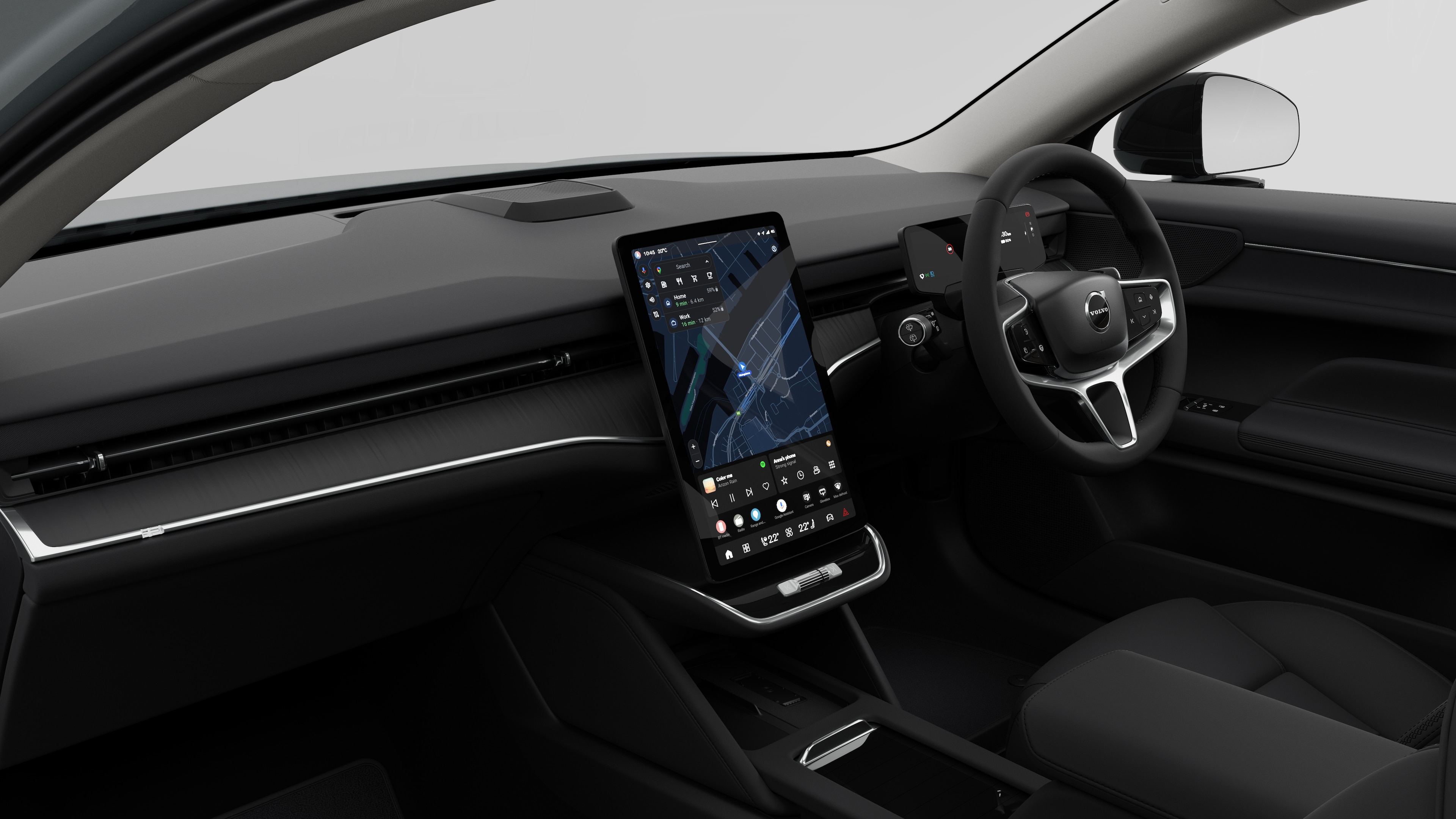 Interior view of a Volvo car showing the dashboard, steering wheel, center console, and digital display screen in a plain studio background.