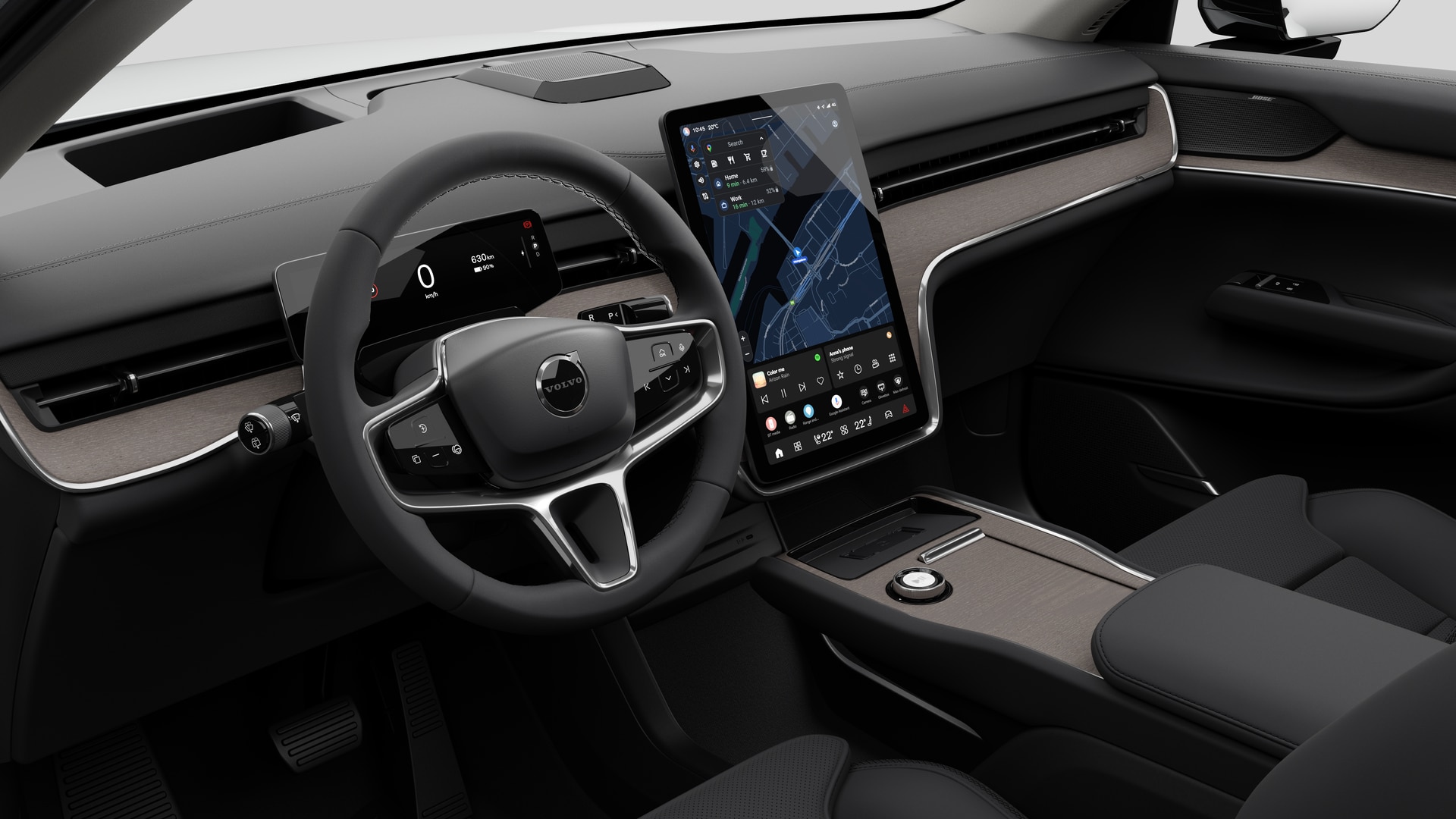 대시보드, 스티어링 휠, 센터 콘솔 및 디지털 디스플레이 화면을 평범한 스튜디오 배경에 보여주는 Volvo 자동차의 내부 모습.