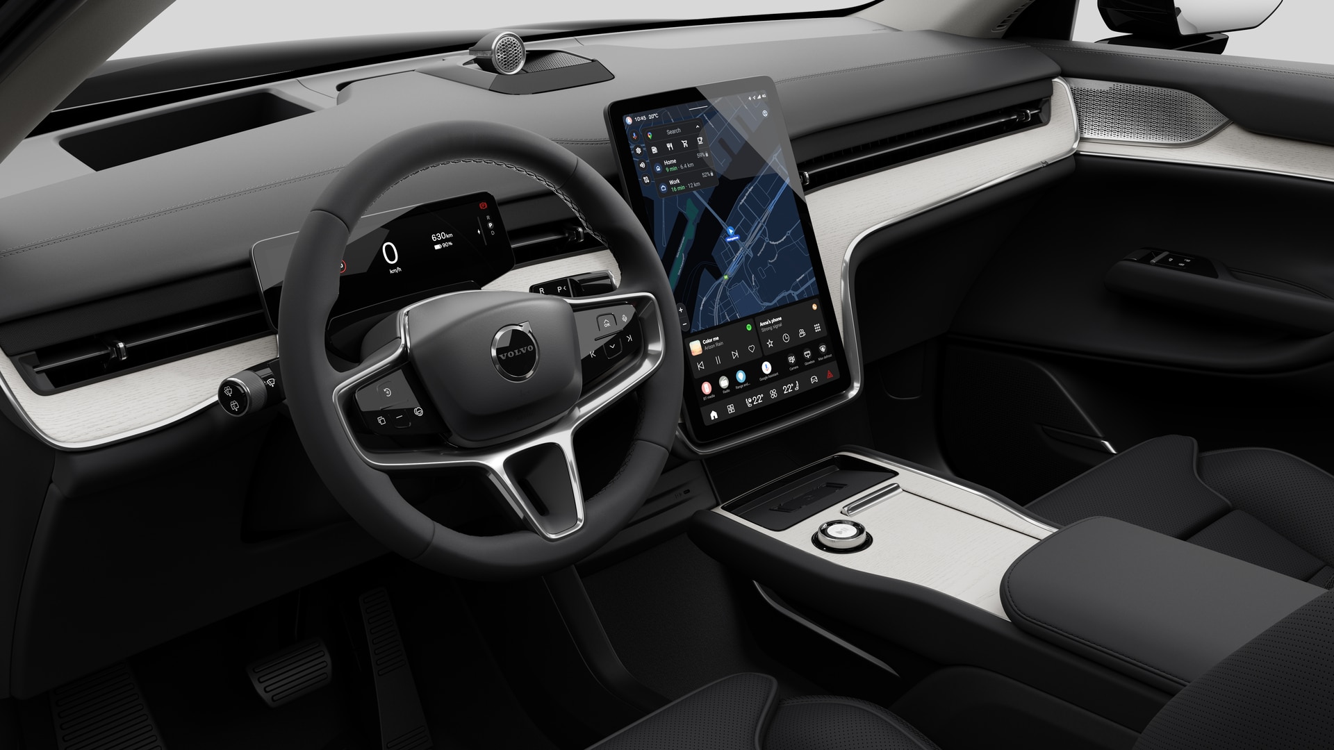 Vue intérieure d’une Volvo montrant le tableau de bord, le volant, la console centrale et l’écran d’affichage numérique sur un fond de studio uni.