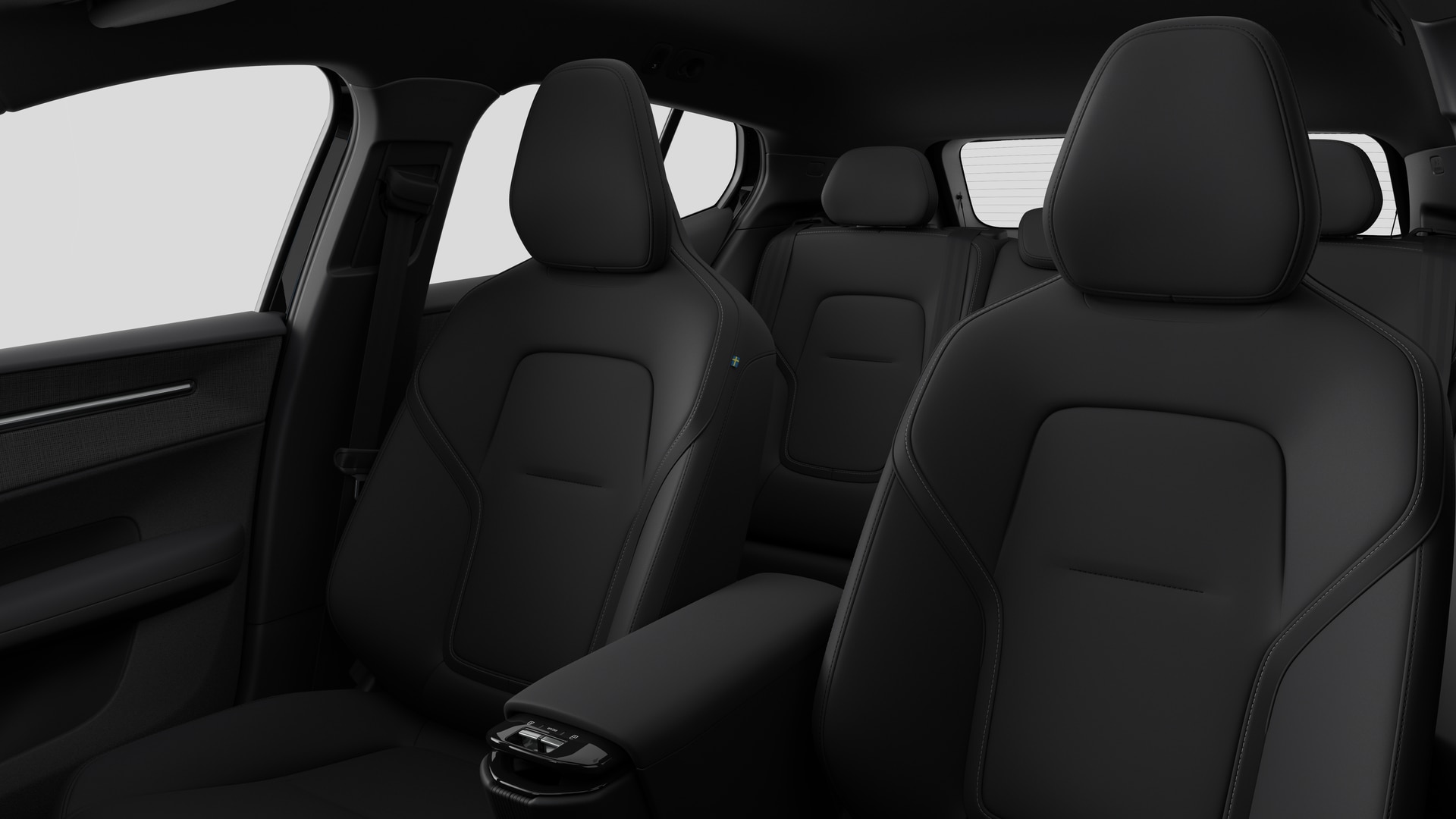 Intérieur d’une Volvo montrant les sièges passager arrière et la console centrale en arrière-plan de studio.