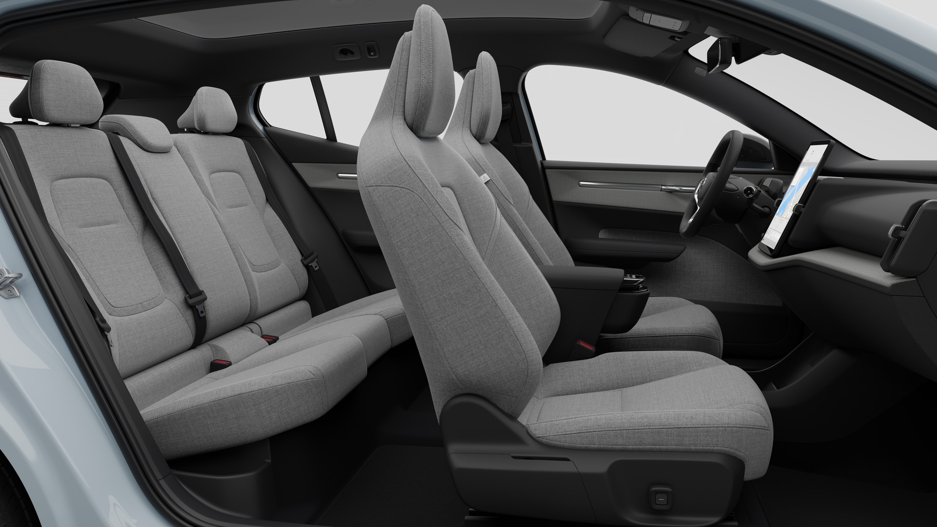 Vue latérale de l’intérieur d’une Volvo montrant les sièges avant, les sièges passager arrière, le volant, le tableau de bord et la console centrale, sur fond de studio.