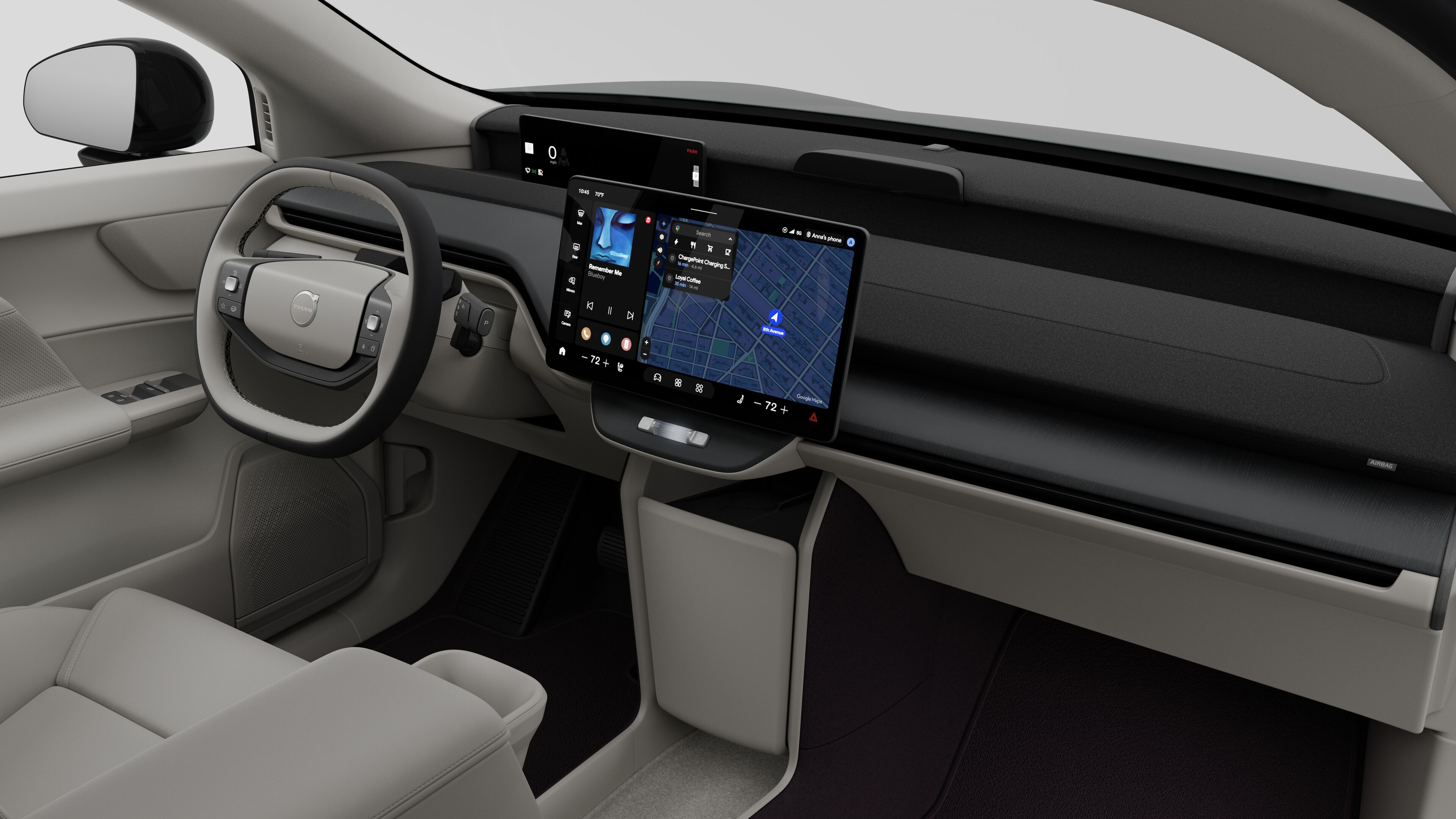 Interior view of a Volvo car showing the dashboard, steering wheel, center console, and digital display screen in a plain studio background.