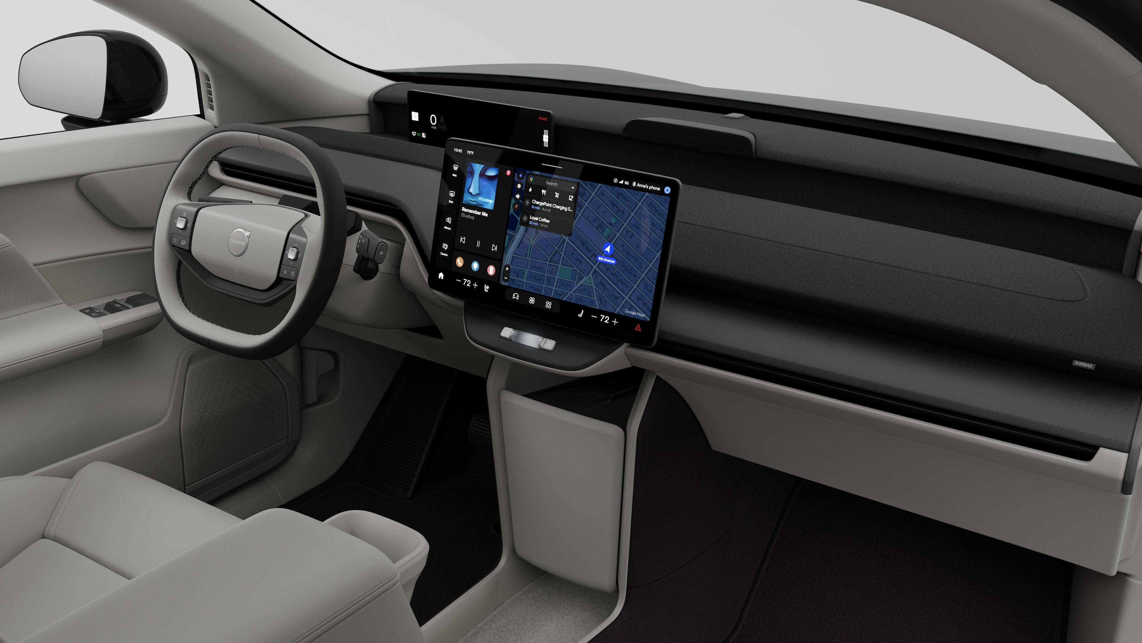 Interior view of a Volvo car showing the dashboard, steering wheel, center console, and digital display screen in a plain studio background.