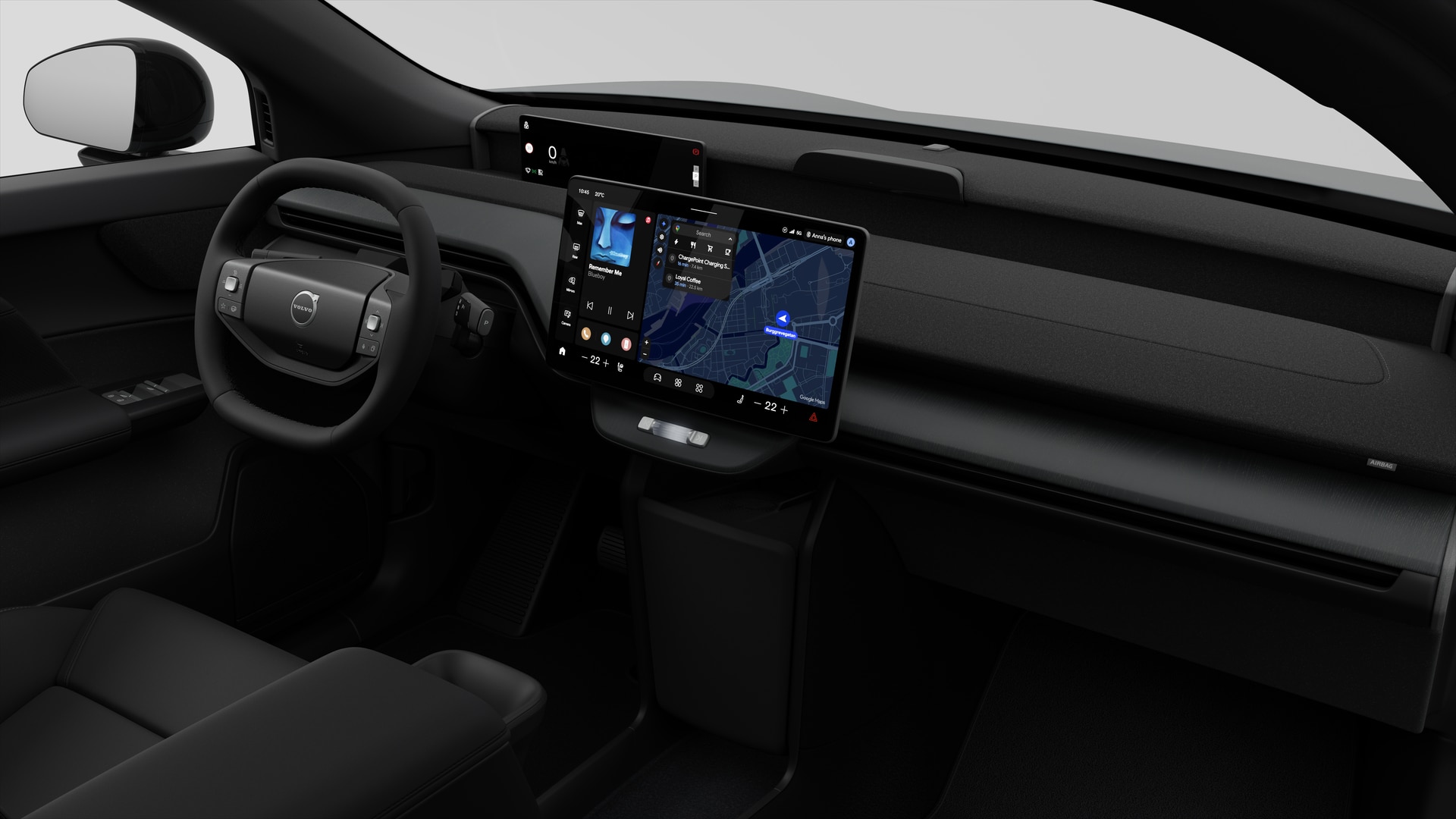 Vue intérieure d’une Volvo montrant le tableau de bord, le volant, la console centrale et l’écran d’affichage numérique sur un fond de studio uni.