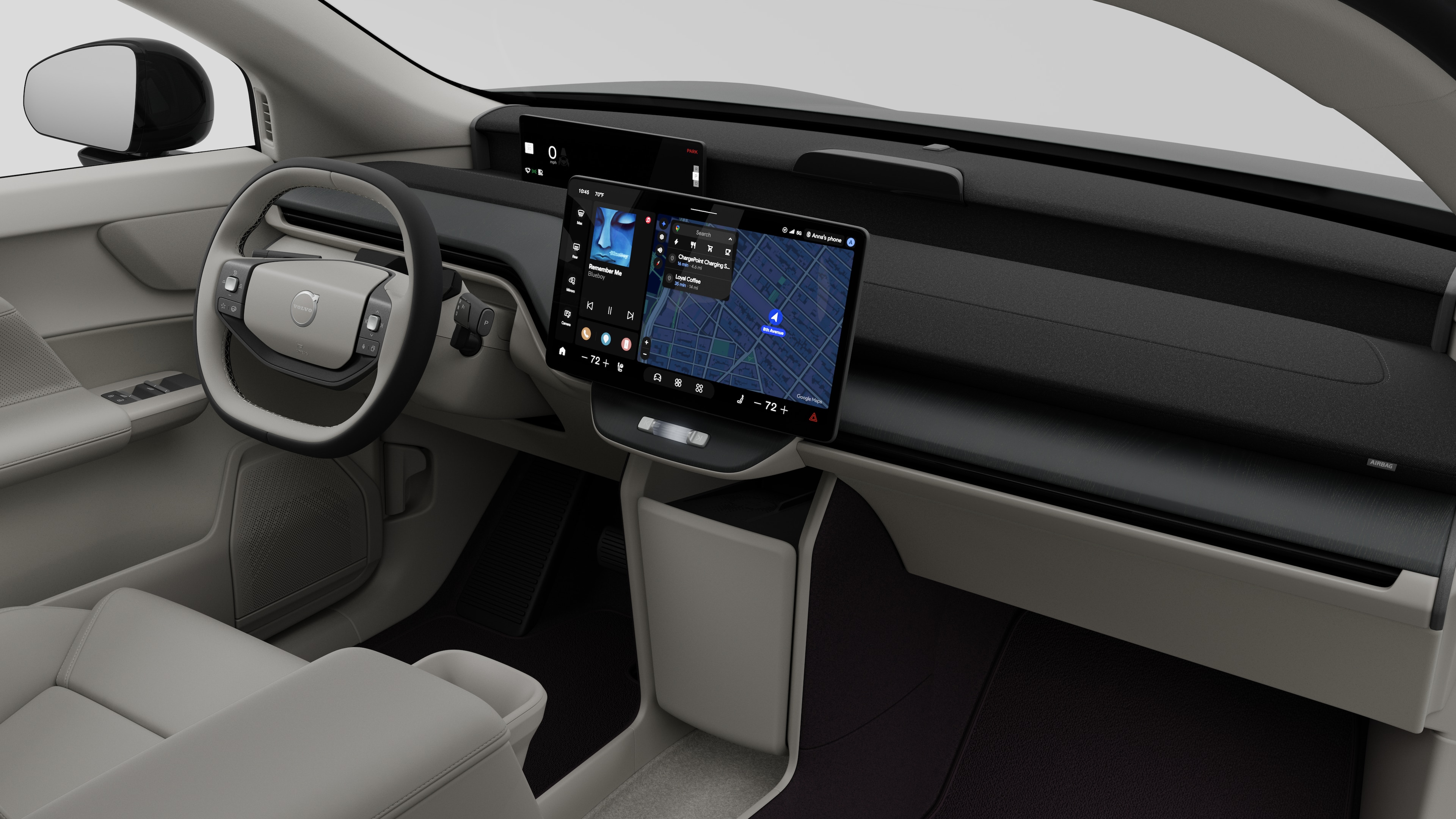 Interior view of a Volvo car showing the dashboard, steering wheel, center console, and digital display screen in a plain studio background.