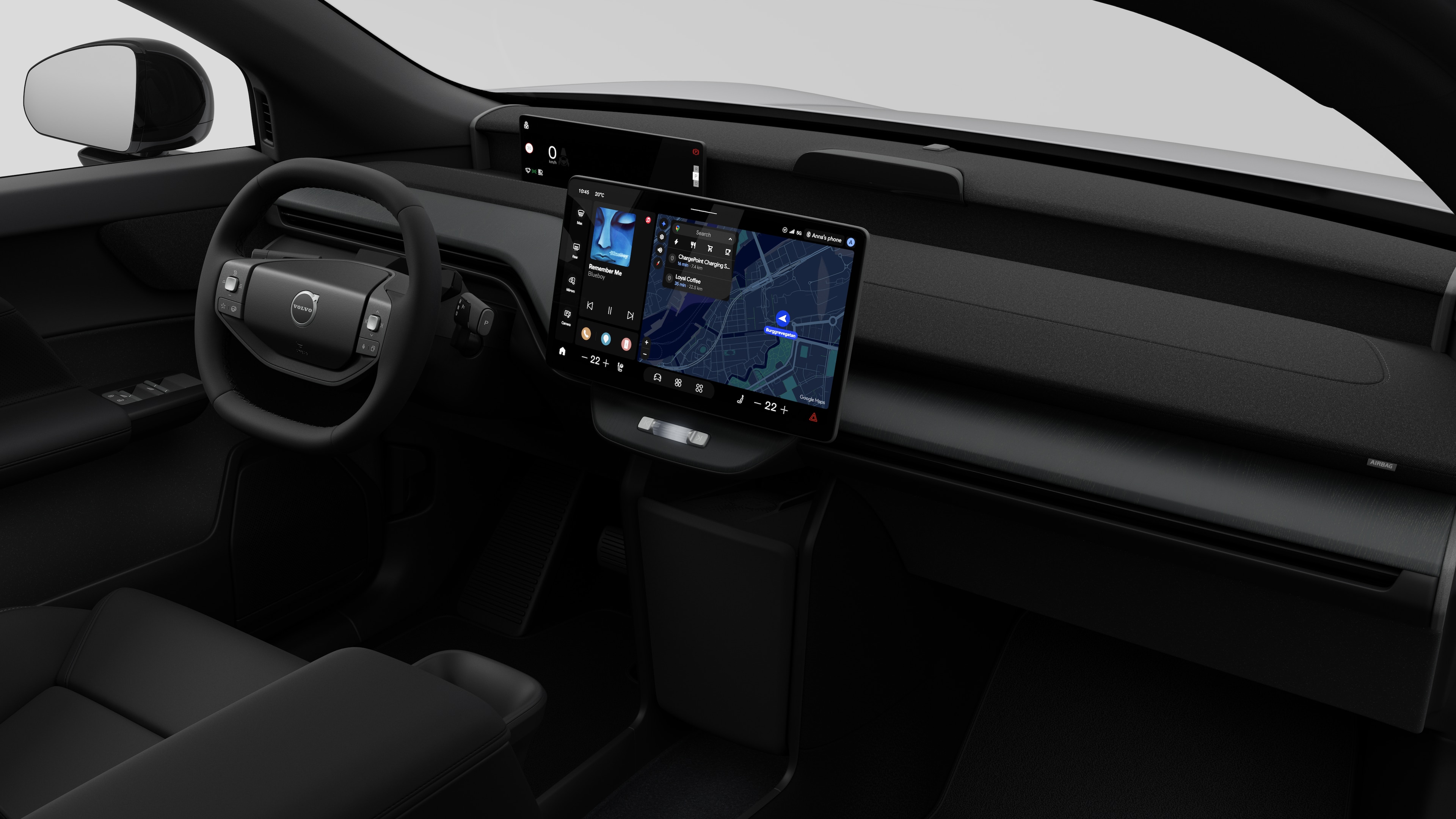 Interiörvy av en Volvobil som visar instrumentbrädan, ratten, mittkonsolen och den digitala skärmen i en vanlig studiobakgrund.