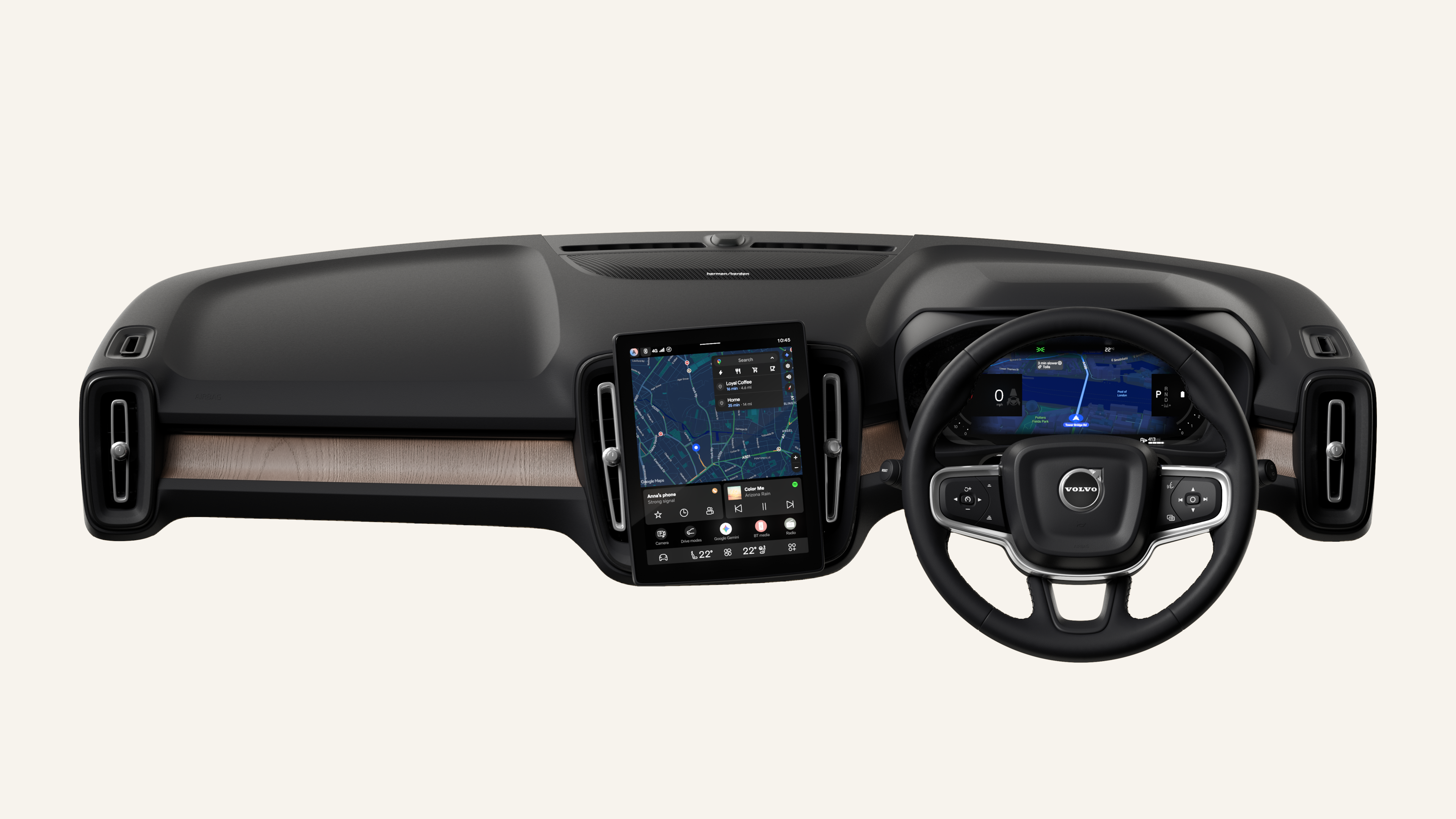 Interior view of a Volvo car showing the dashboard, steering wheel, and center console screen against a plain studio background.