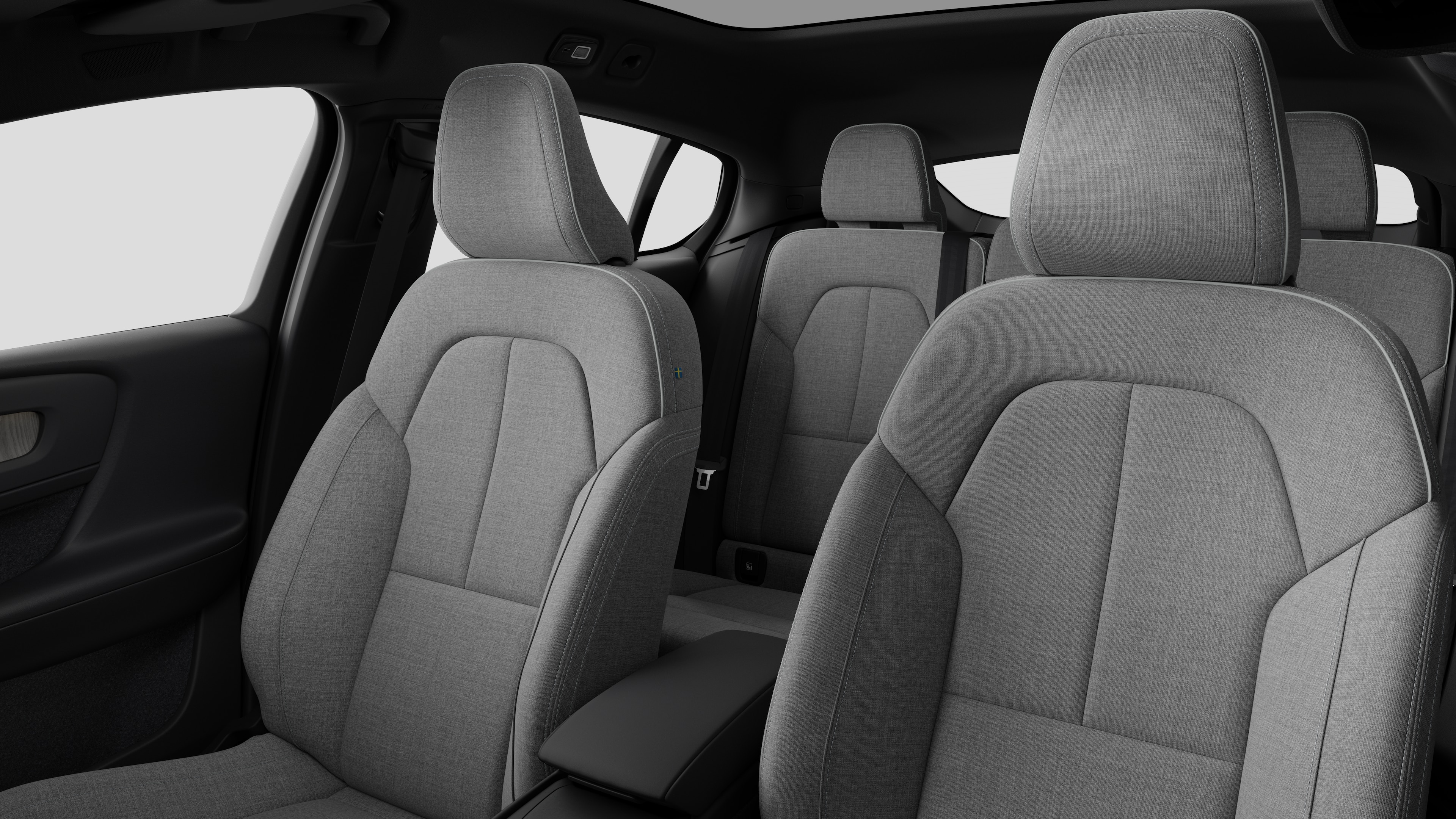 Volvo -auton sisätilat, takamatkustajan istuimet ja keskikonsoli selkeällä studiotaustalla.